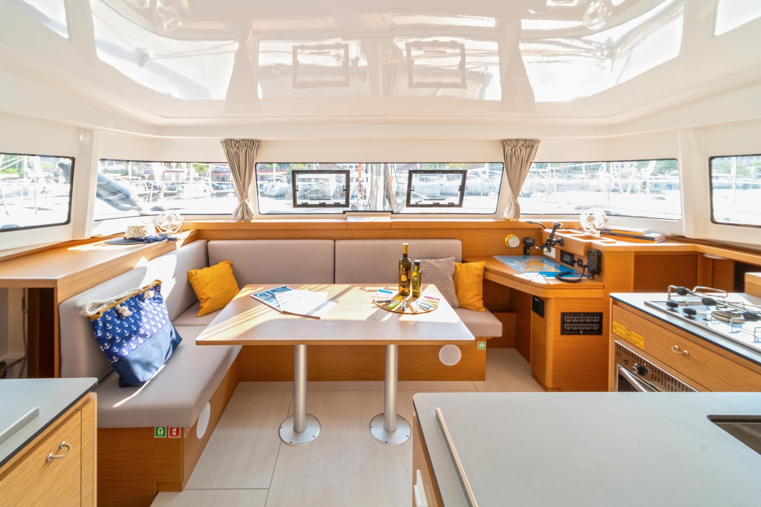 Luxurious interior of 2023 Excess 11 yacht with modern kitchen and dining area.