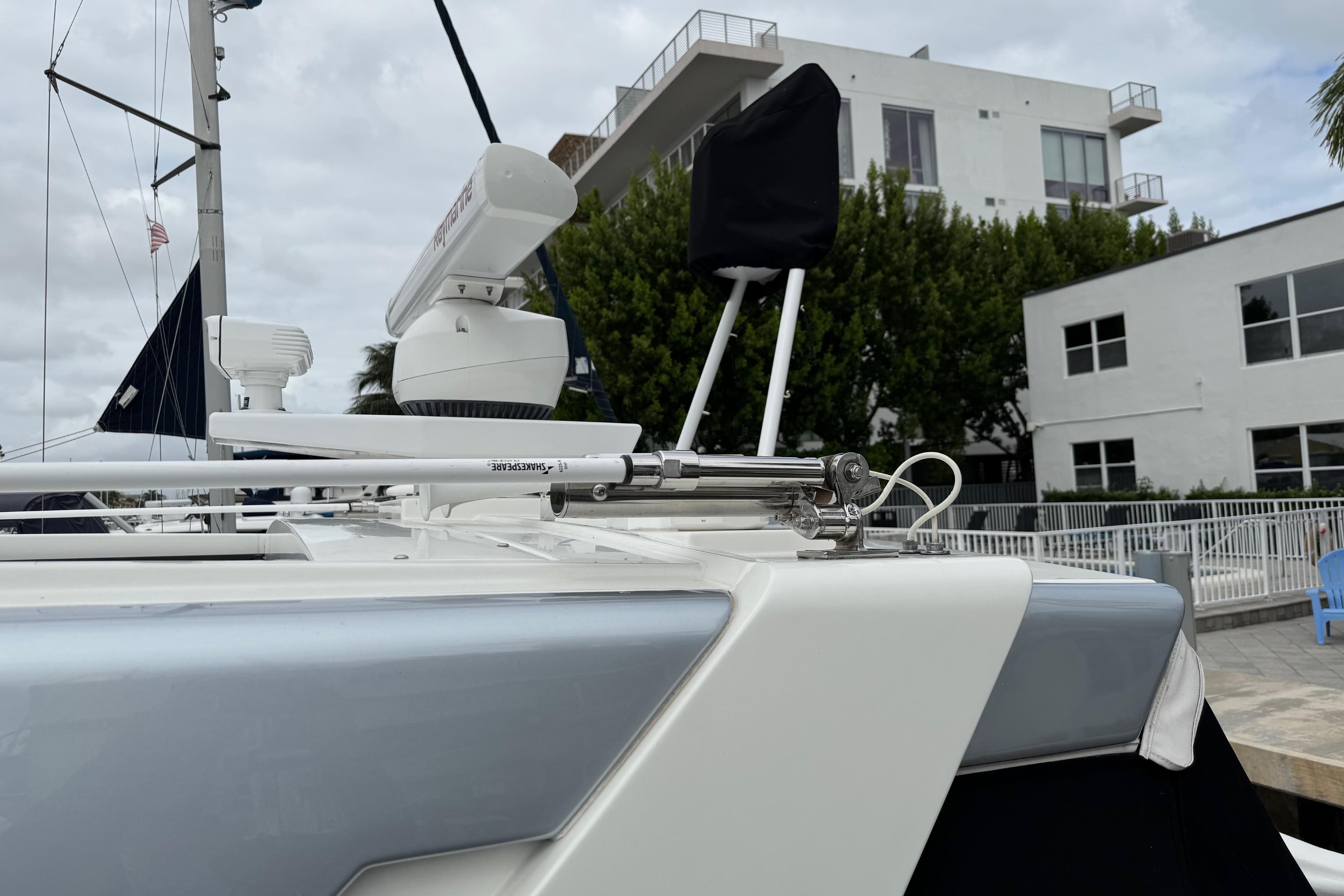 2023 Formula 400 Super Sport Crossover yacht docked near modern buildings.