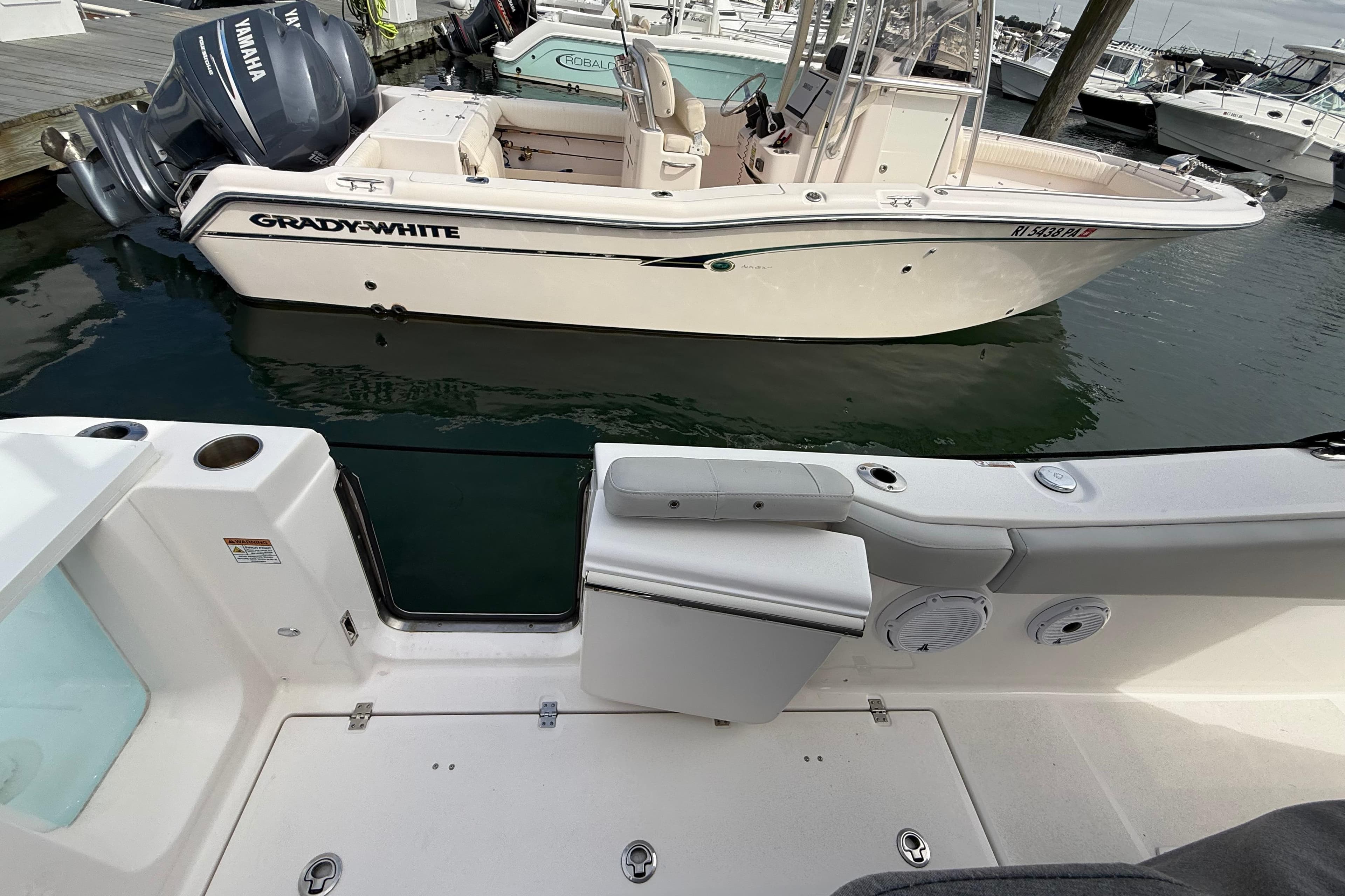 2021 Sea Fox 288 Commander docked near Grady-White boat in marina.