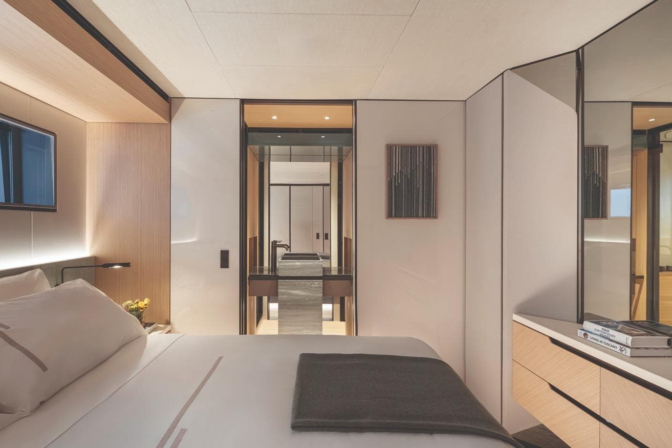 Luxurious bedroom interior of 2026 Azimut GRANDE 30M yacht, featuring modern design and elegant furnishings.