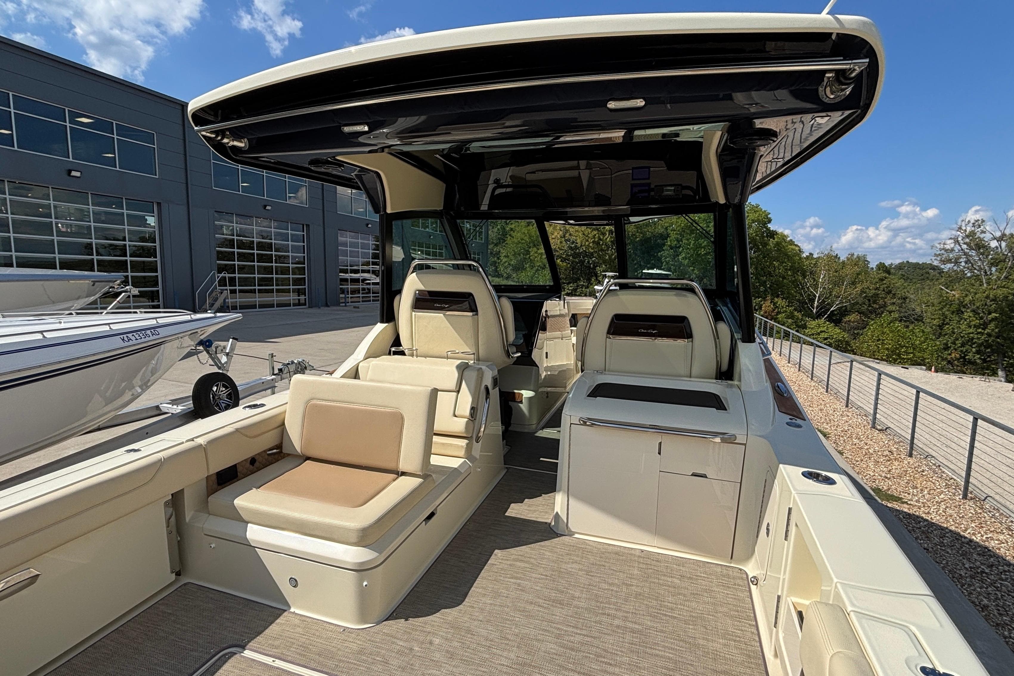 2021 Chris-Craft Calypso 35 boat interior with seating and helm, docked outdoors.