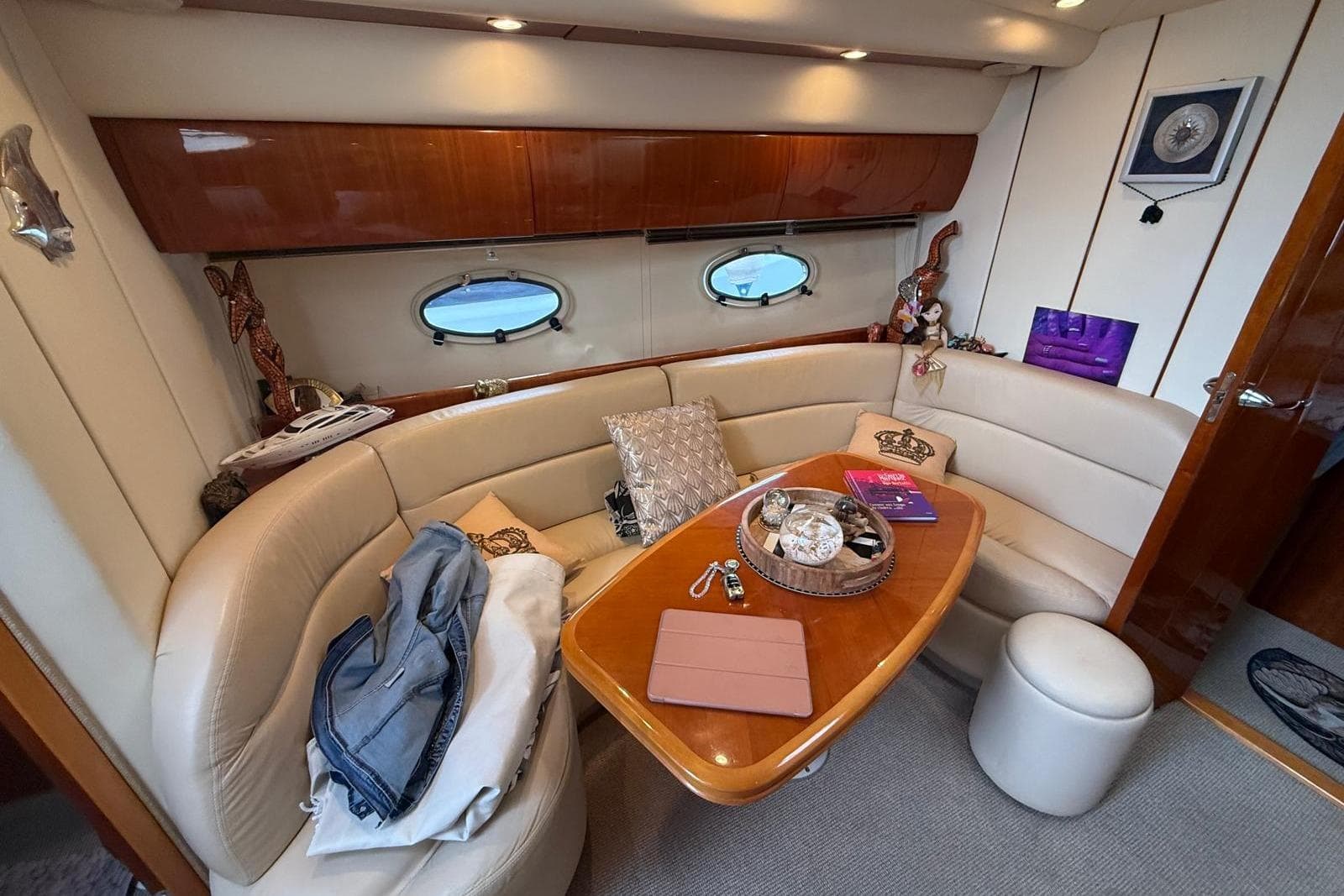 Luxurious interior of a 2002 Princess V42 yacht with elegant seating and decor.