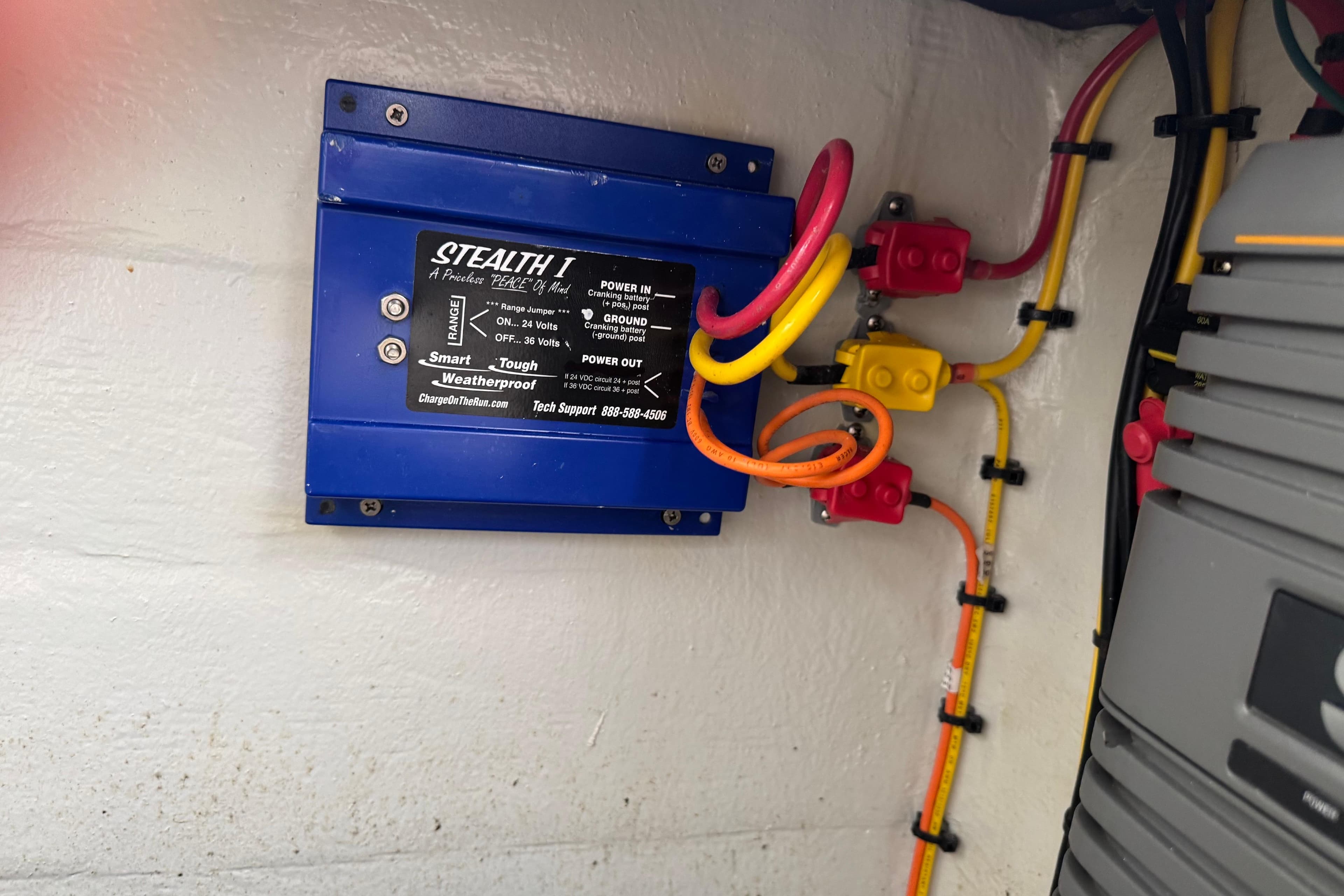 Electrical system in a 2024 SeaVee 32Z boat featuring a Stealth I charger.