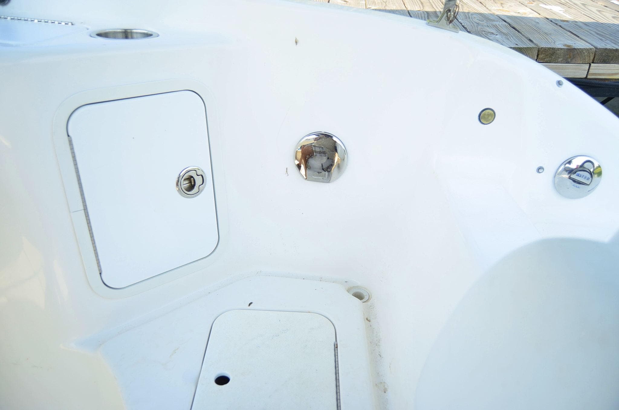 2011 Hurricane SUNDECK 217 boat interior with storage compartments and sleek design.