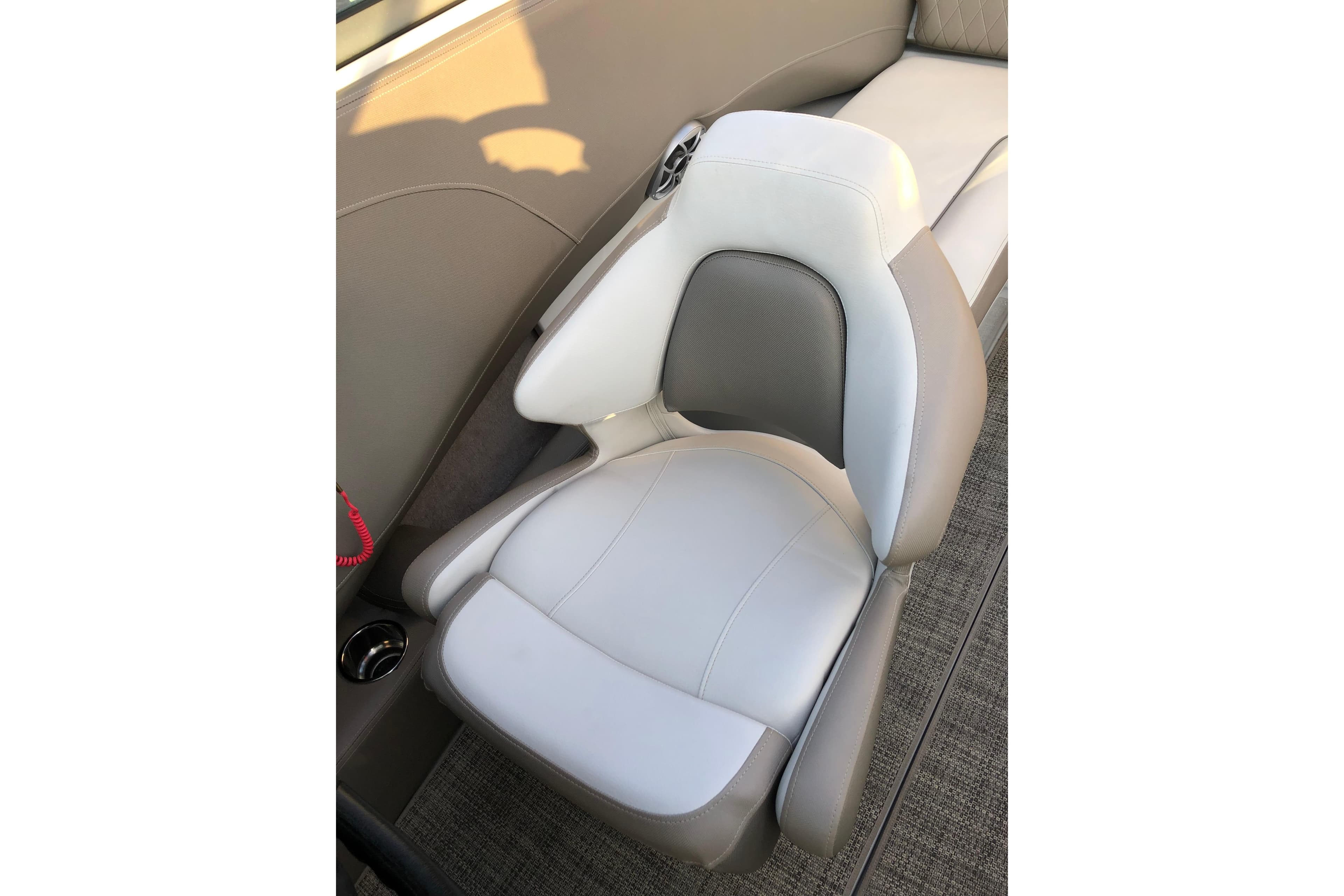 2020 Crownline 235 SS boat seat with beige and white upholstery.
