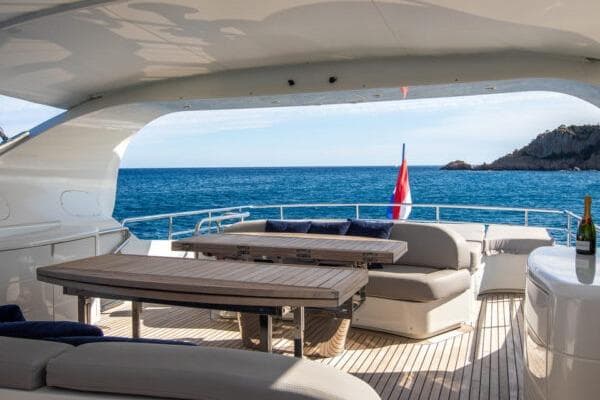 Luxurious 2009 Maiora 31DP yacht deck with ocean view and seating area.