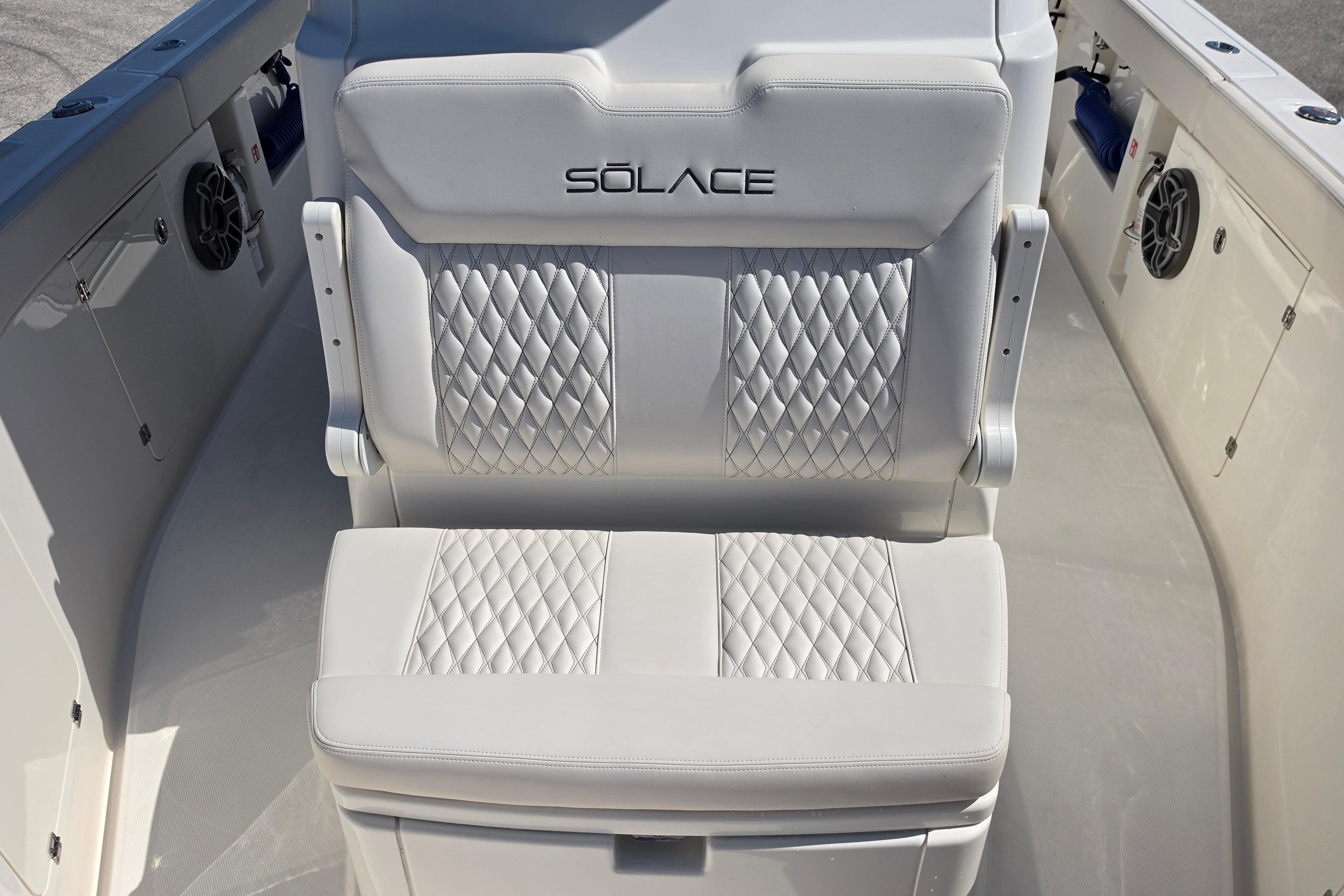 Luxurious seating on 2026 Solace 30CS boat with diamond-stitched upholstery.