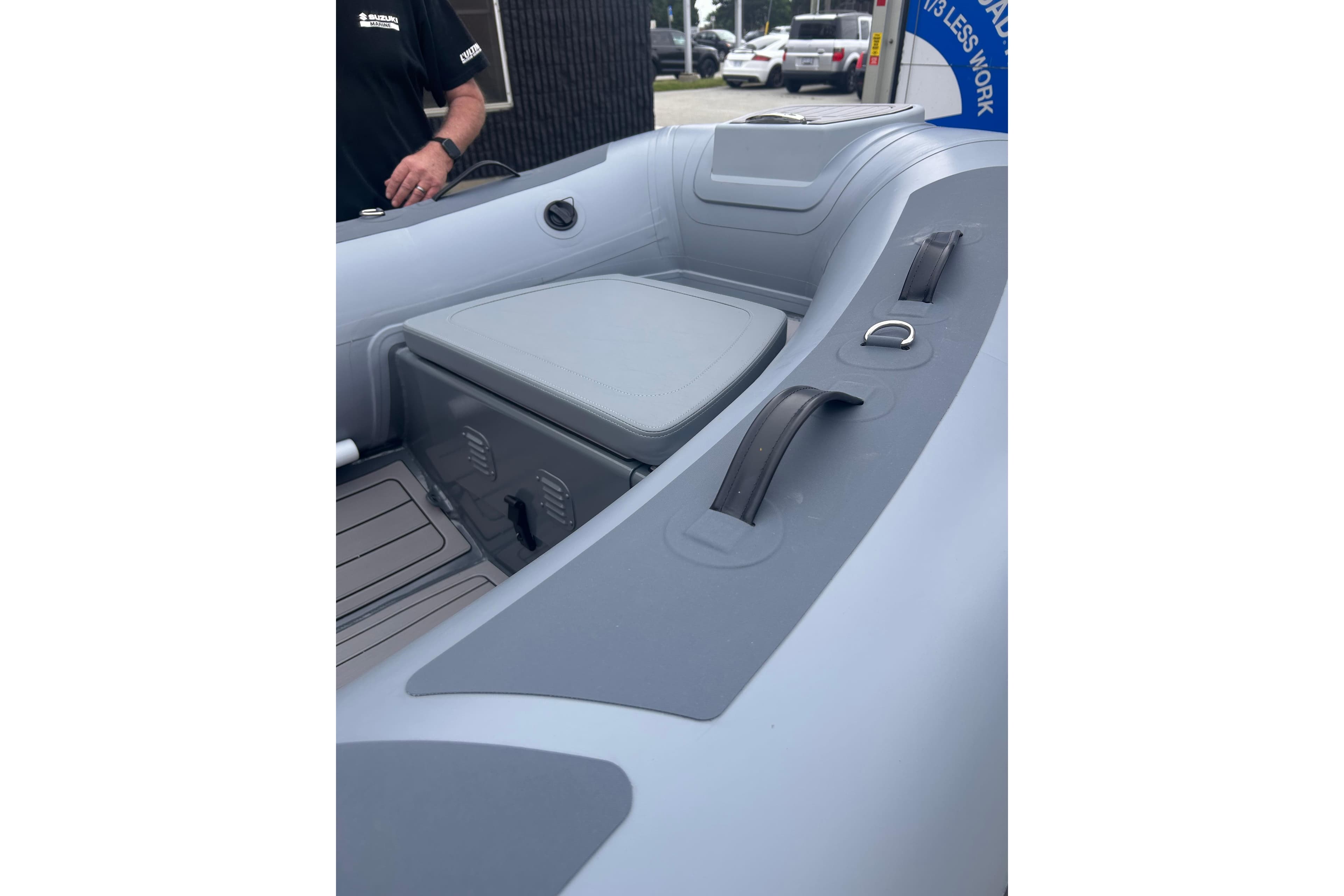 Inflatable boat interior, Hunter 466 model, 2002, featuring seating and storage compartments.