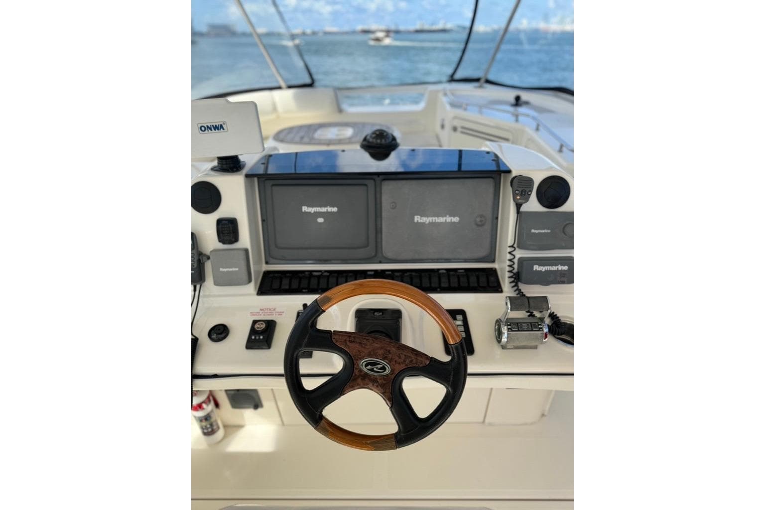 Helm of 2005 Sea Ray 580 Sedan Bridge with Raymarine navigation system.