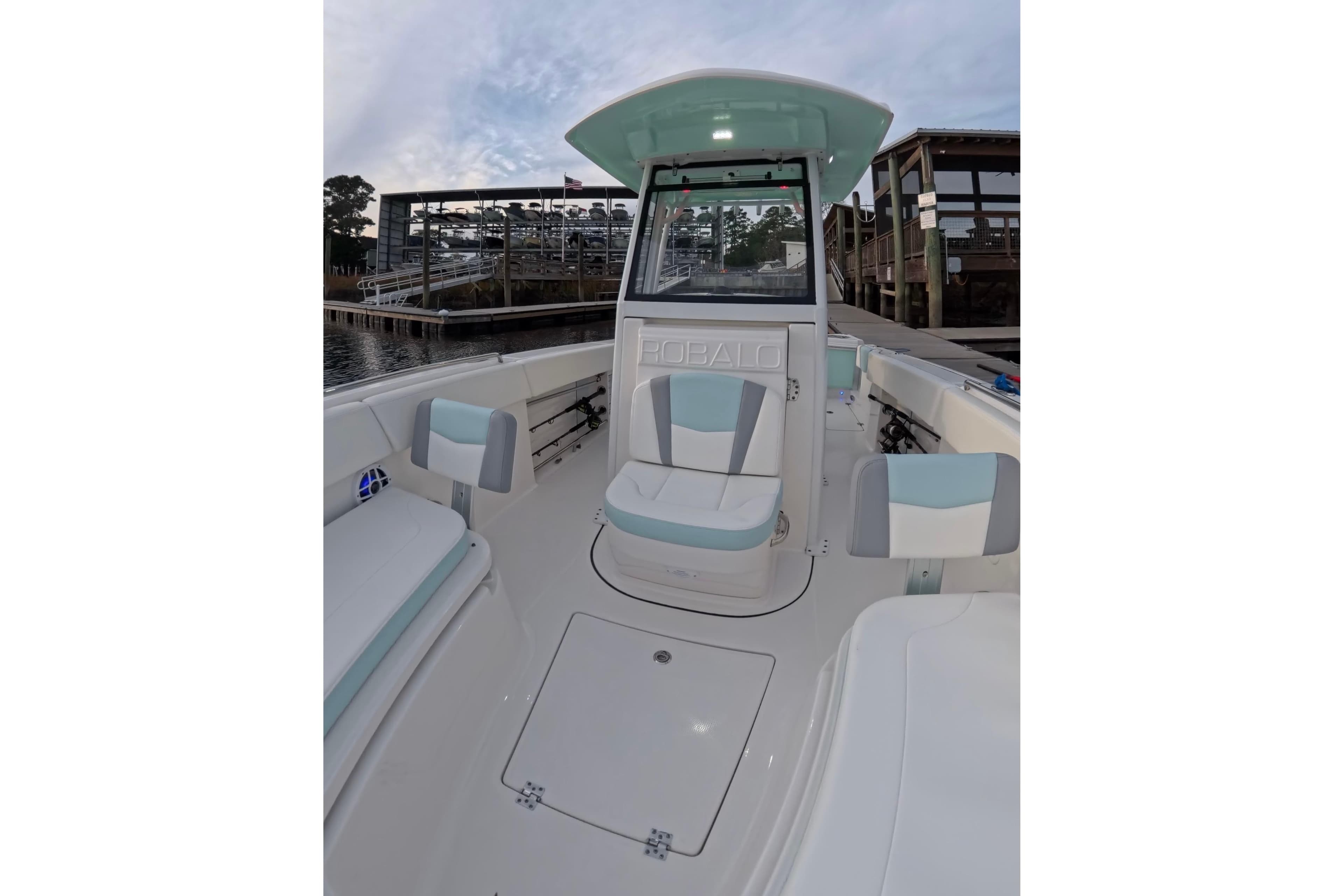 2025 Robalo R250 Center Console boat interior with seating and console view.