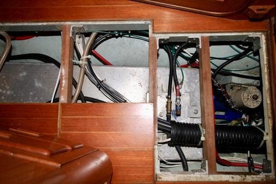Engine compartment of a 1981 Ta-Shing Panda 40 sailboat, showing wiring and components.