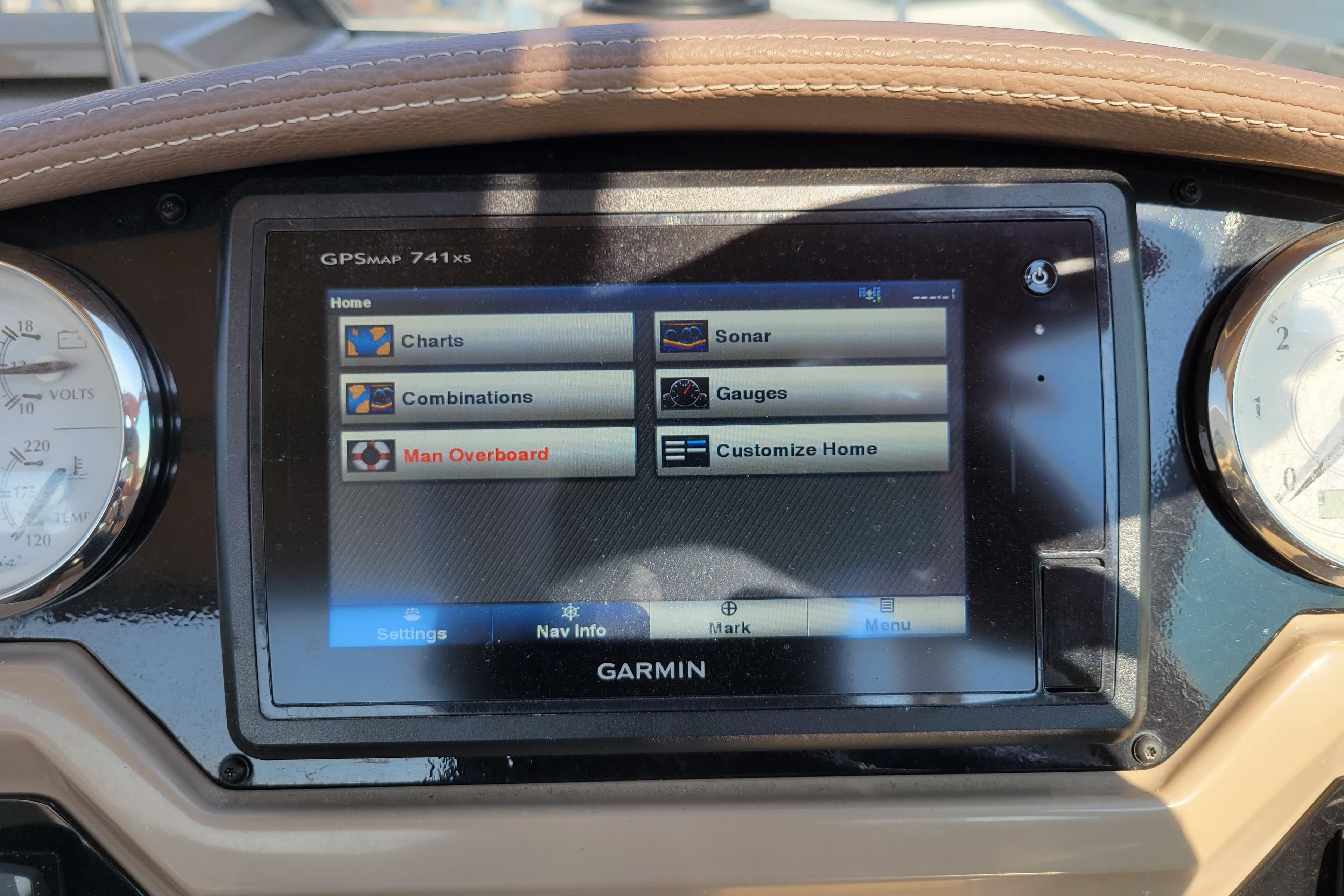 Garmin GPS display on 2018 Regal 26 Express boat dashboard, showing navigation options.