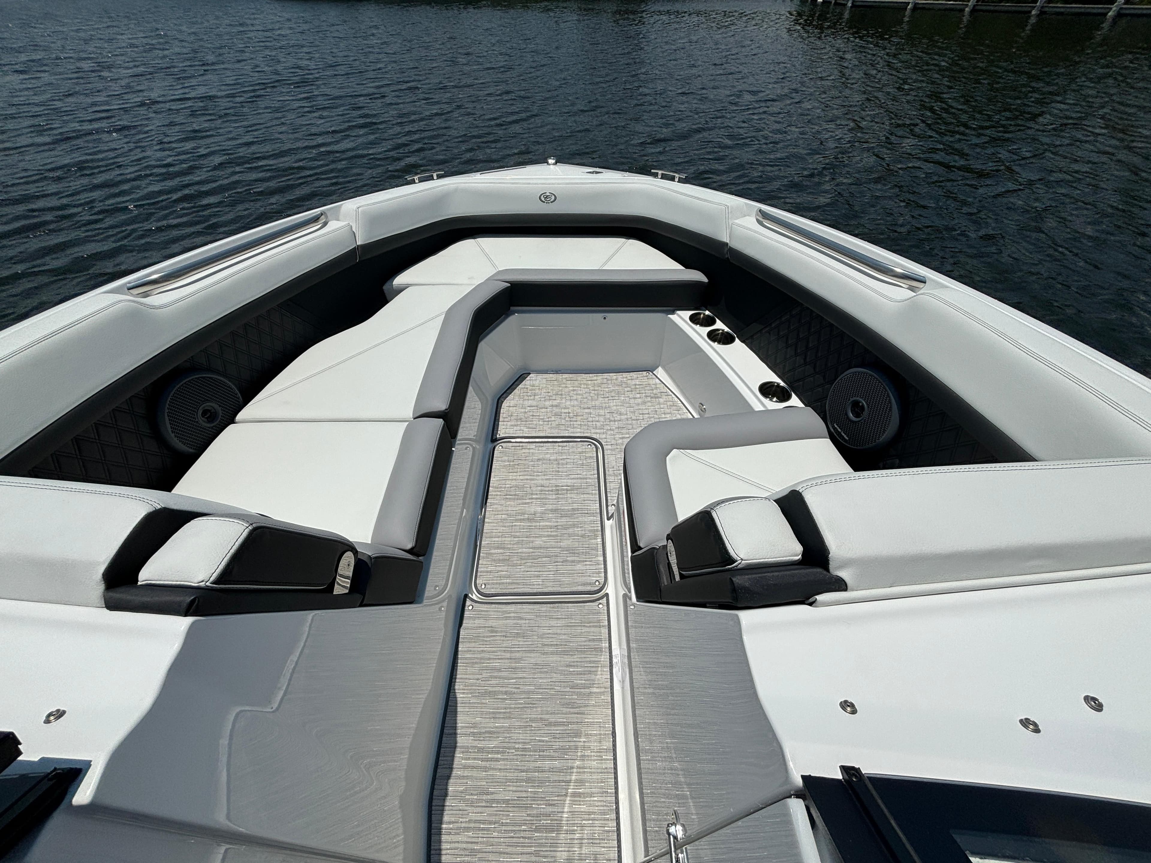 2024 Cobalt R8 Outboard boat with spacious seating and modern design on the water.