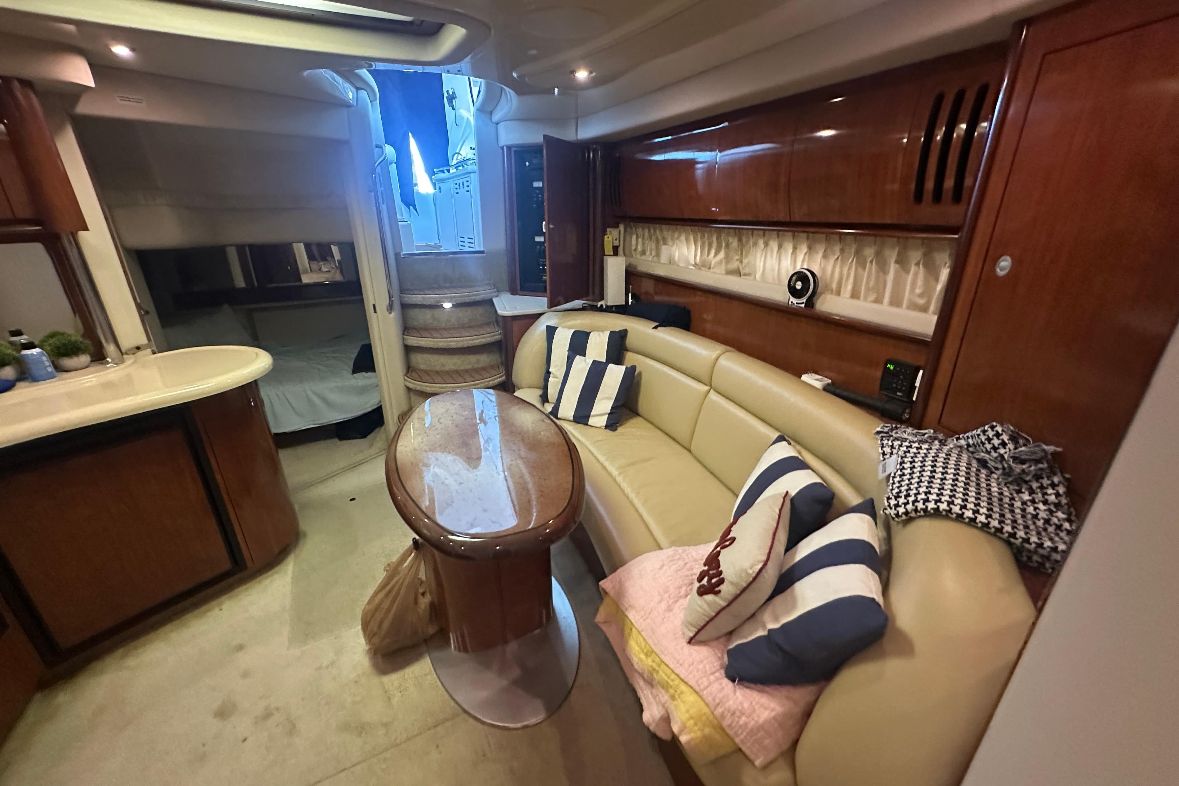 Luxurious interior of a 2004 Sea Ray 420 Sundancer yacht with elegant seating and decor.
