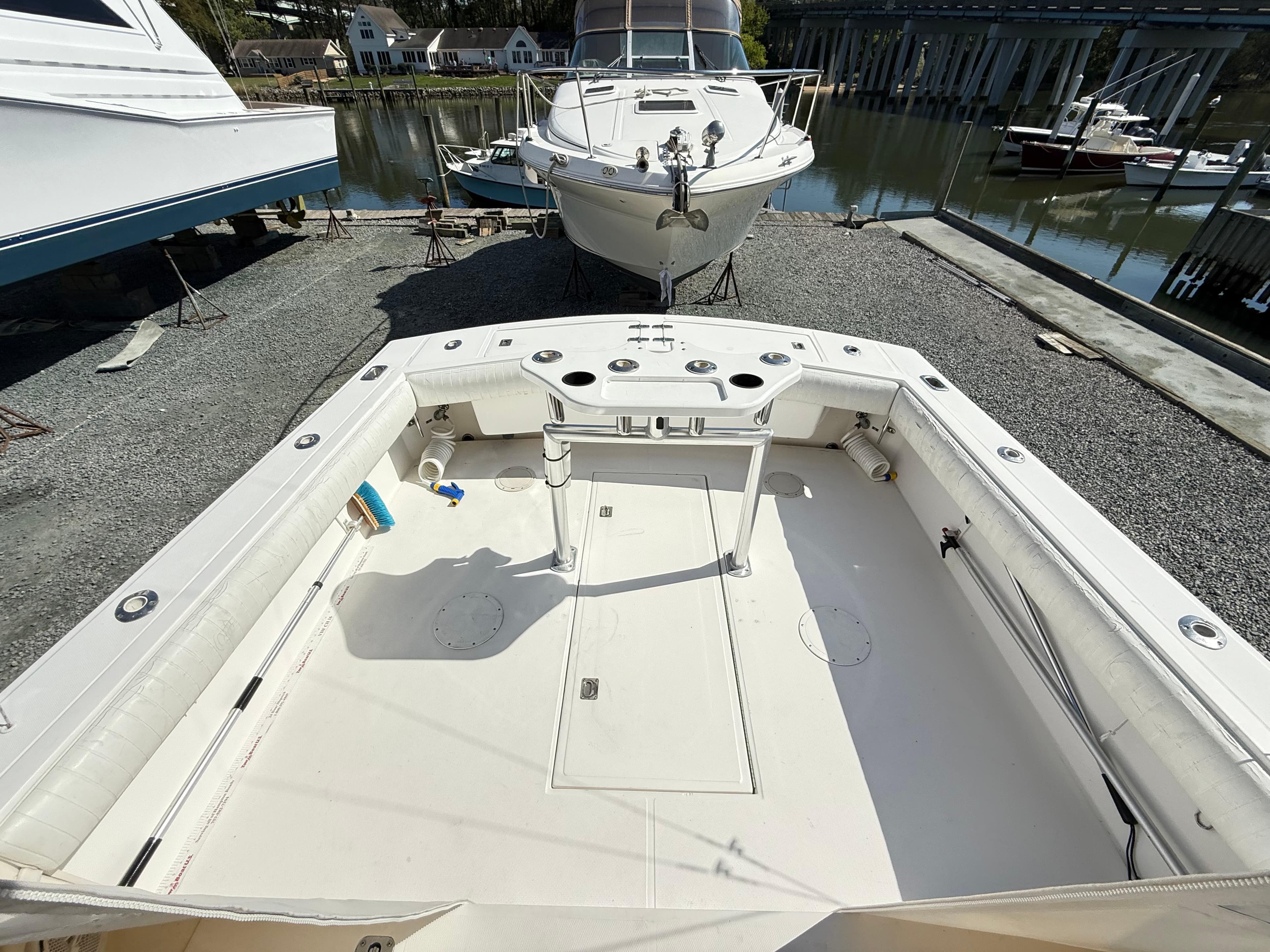 2001 Albemarle 280 Express Sport Fisherman boat, spacious deck, docked near water.