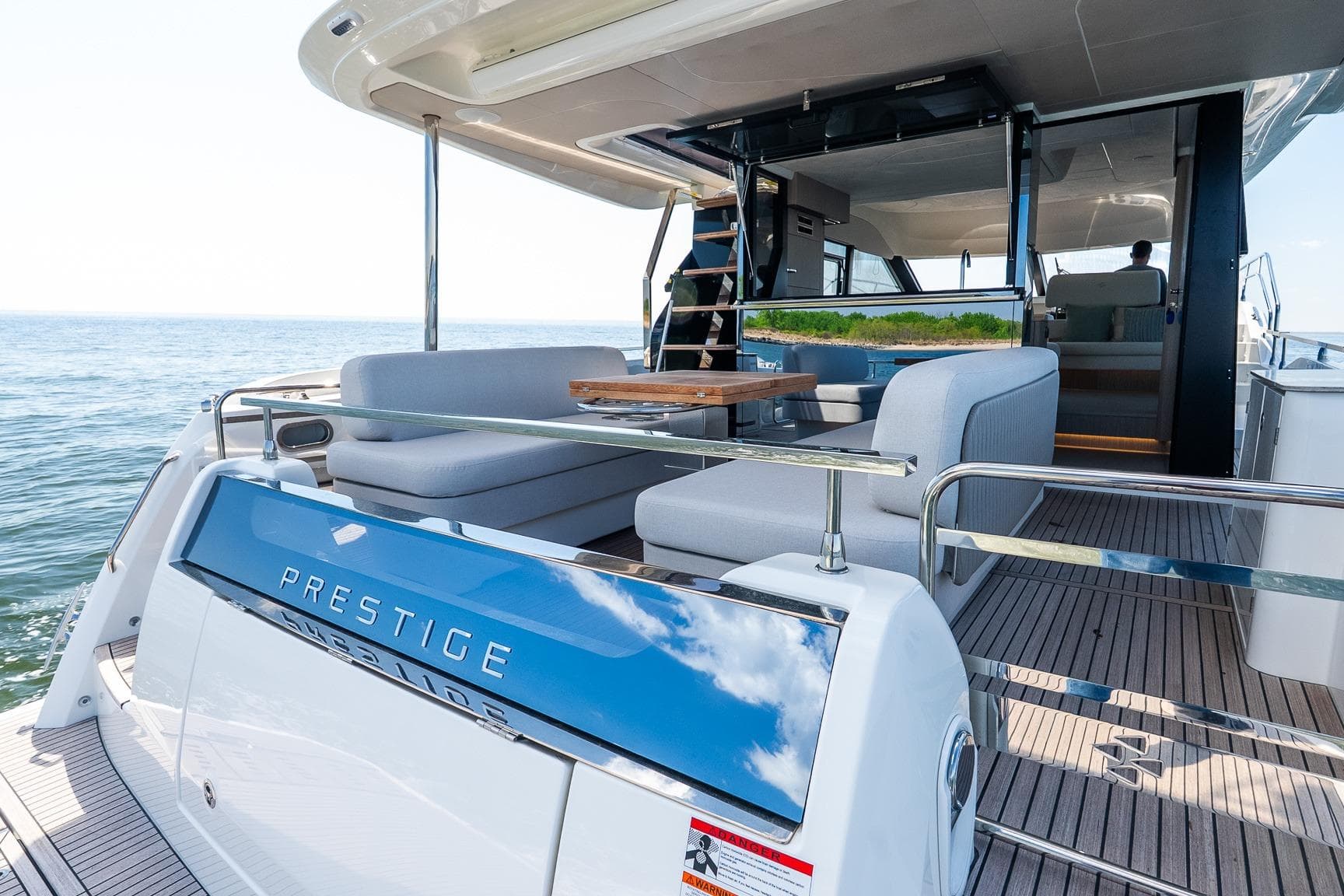 Luxurious 2026 Prestige F5.7 yacht with spacious deck and modern seating.