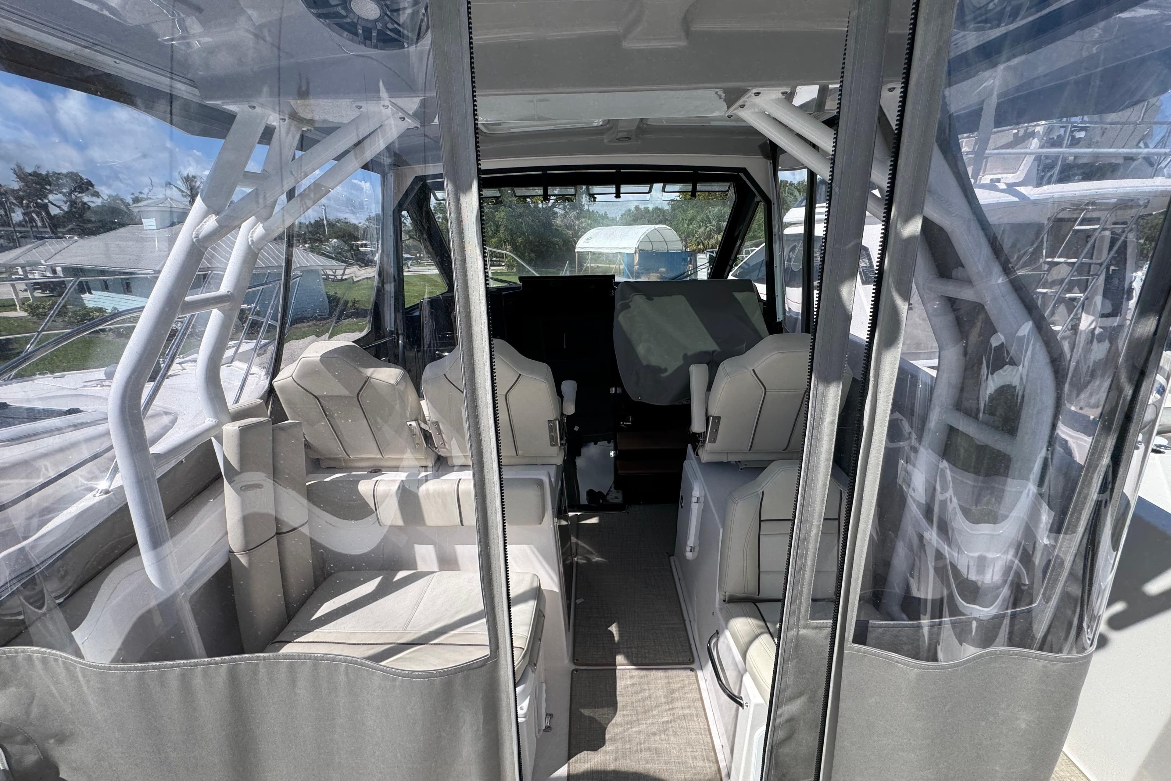 Interior view of 2026 Solara S-310 CW boat, featuring modern seating and clear enclosures.