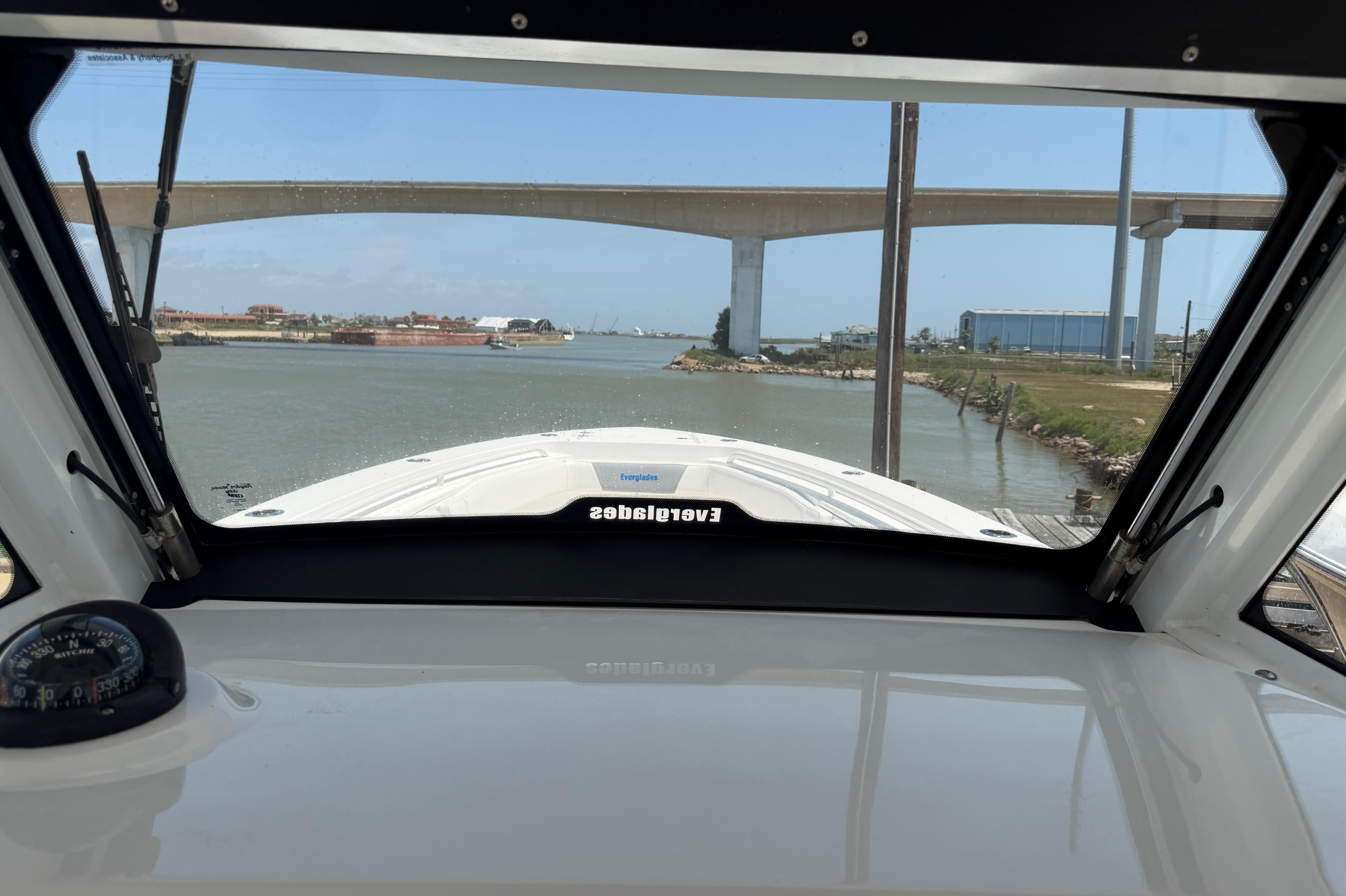 View from 2018 Everglades 355 Center Console boat navigating under a bridge.