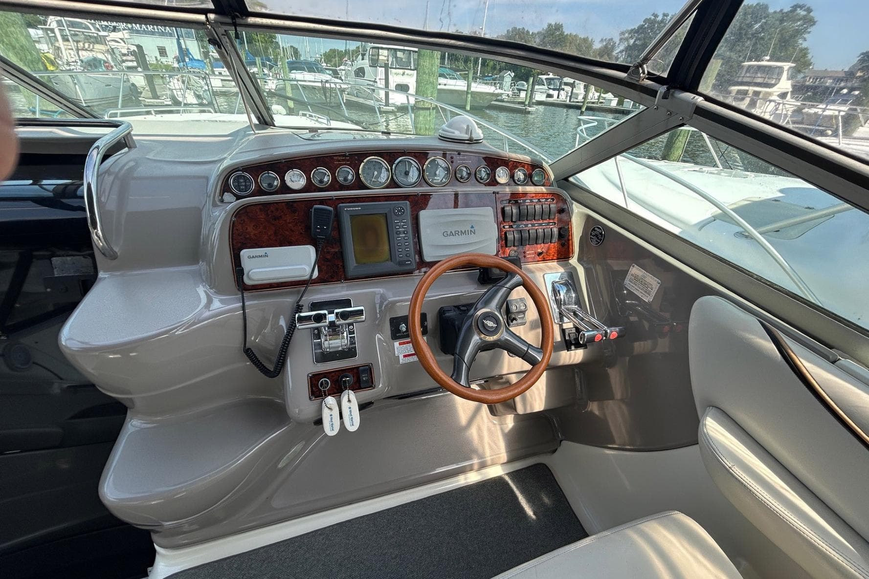 Cockpit of 2001 Wellcraft 3700 Martinique with steering wheel and navigation instruments.