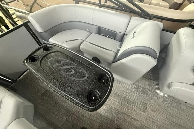 Interior of 2026 Bentley Pontoons Legacy 200 Navigator with sleek seating and table design.