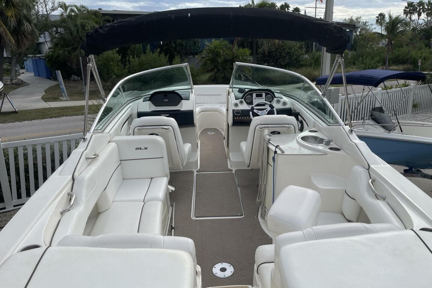 2008 Sea Ray 270 SLX boat with white seating and sleek interior design.