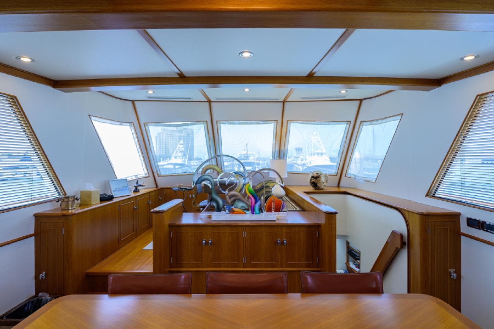 Luxurious 2003 New England Boatworks Enclosed Raised Pilothouse interior with panoramic windows.