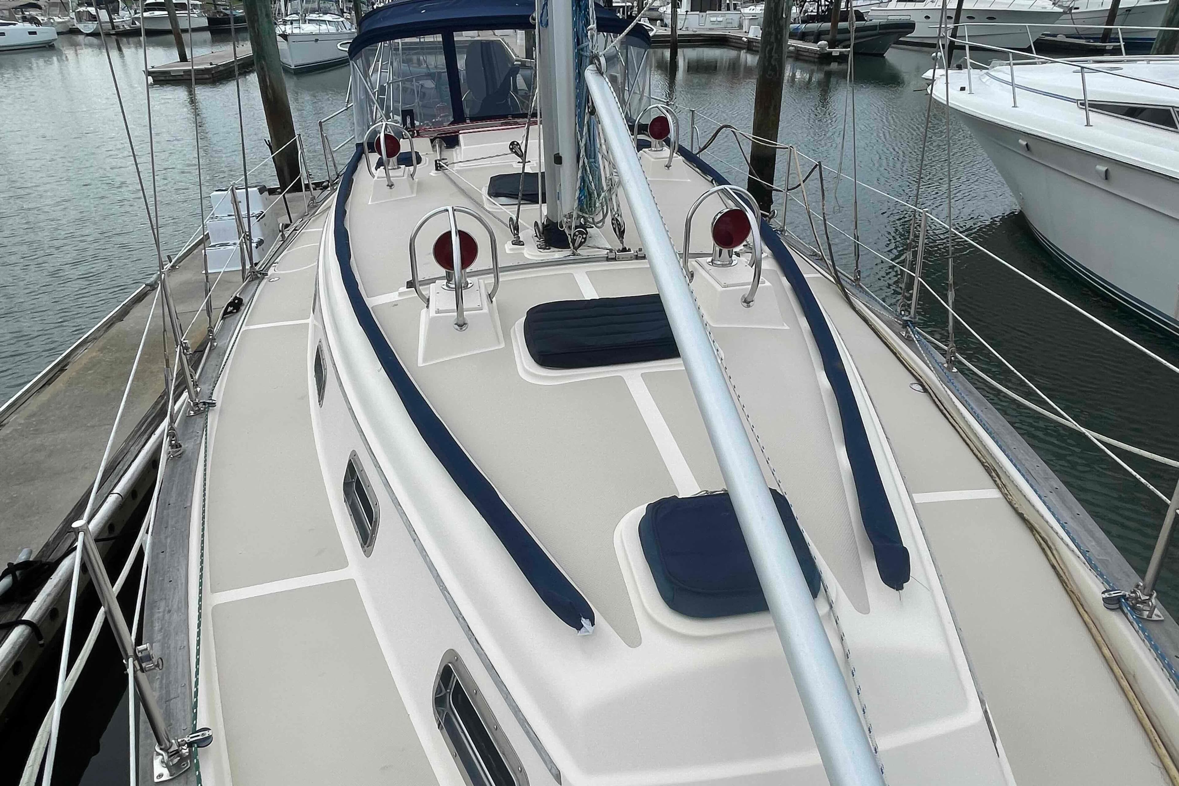 1998 Island Packet 40 sailboat docked at marina, showcasing deck and rigging.