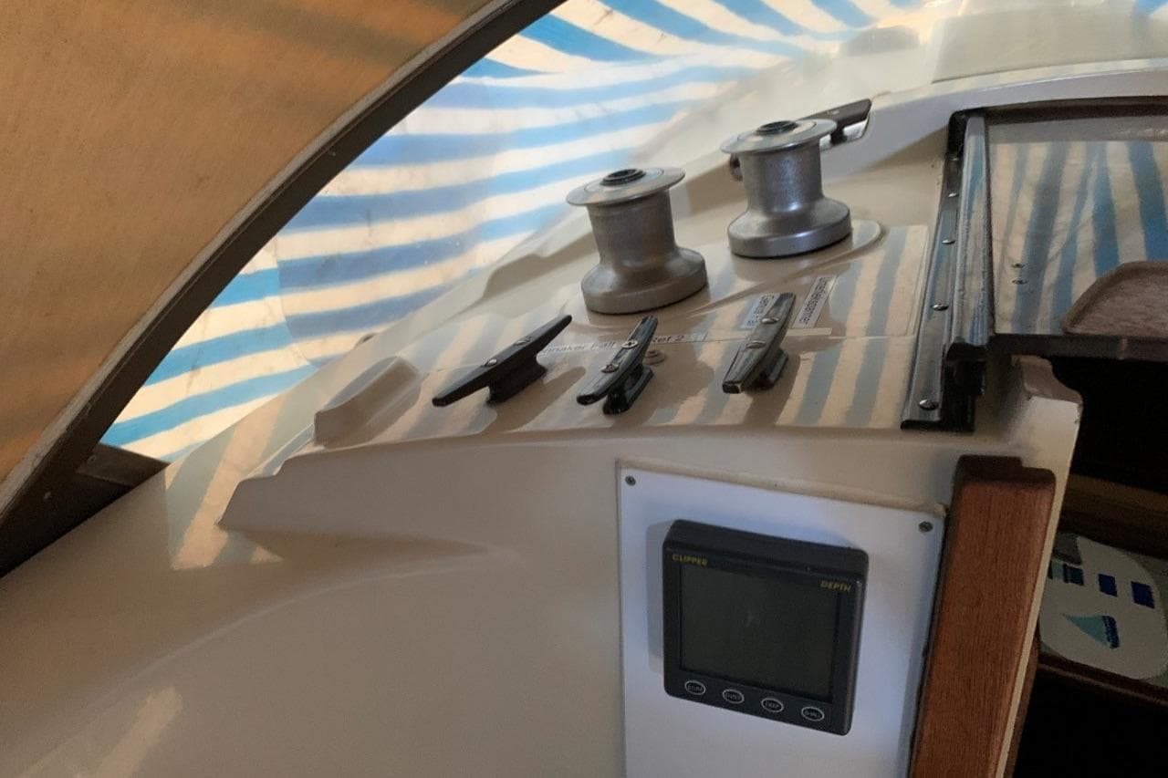 Interior view of 1980 Dehler Optima 98 sailboat with winches and control panel.