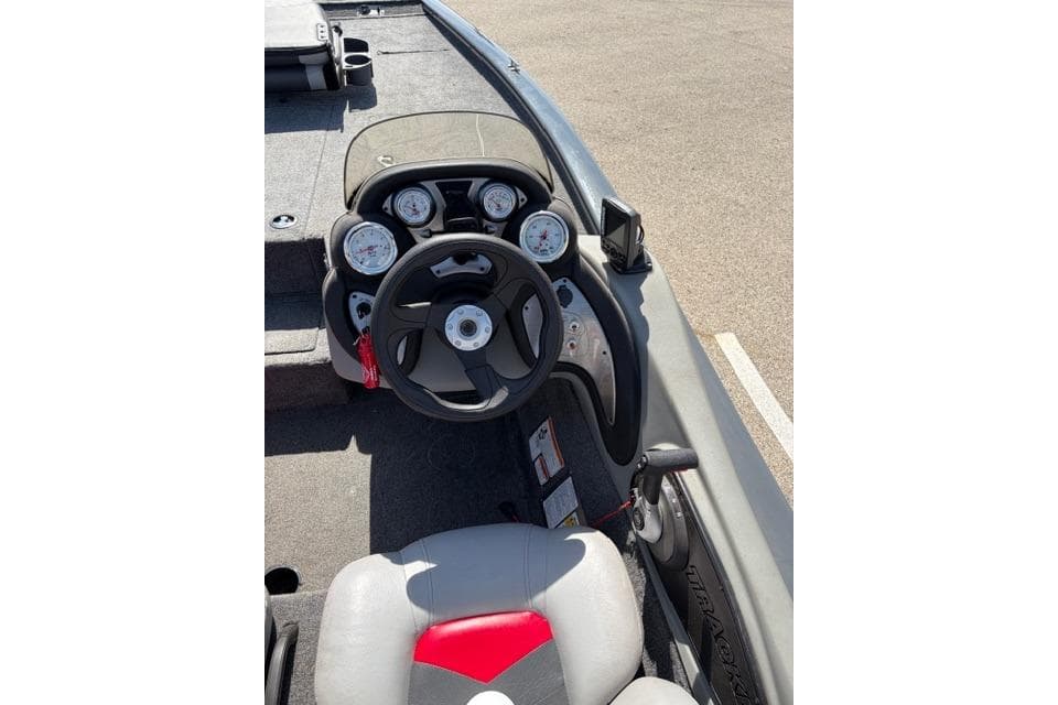 2016 Tracker Pro Team 195 TXW Tournament Edition boat cockpit with steering wheel and gauges.