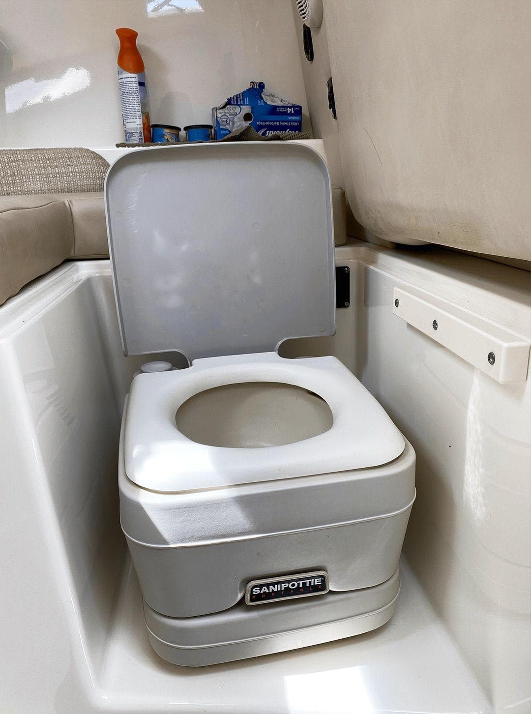 Portable toilet in 2009 Boston Whaler 255 Conquest boat cabin.