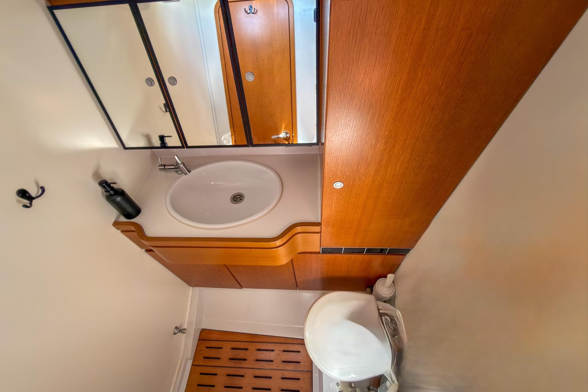 Luxurious bathroom interior of 2010 Grand Soleil 46 yacht with wooden cabinetry.