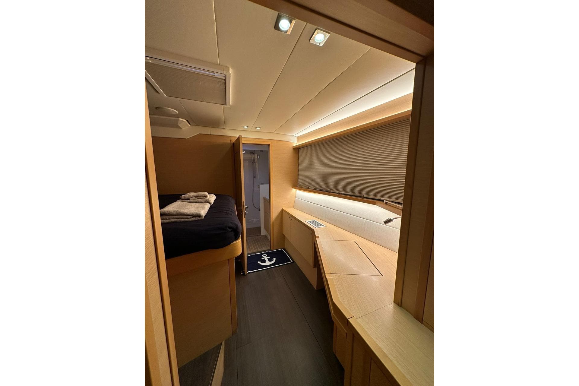 Luxurious interior of 2013 Lagoon 620 yacht cabin with modern design and cozy lighting.