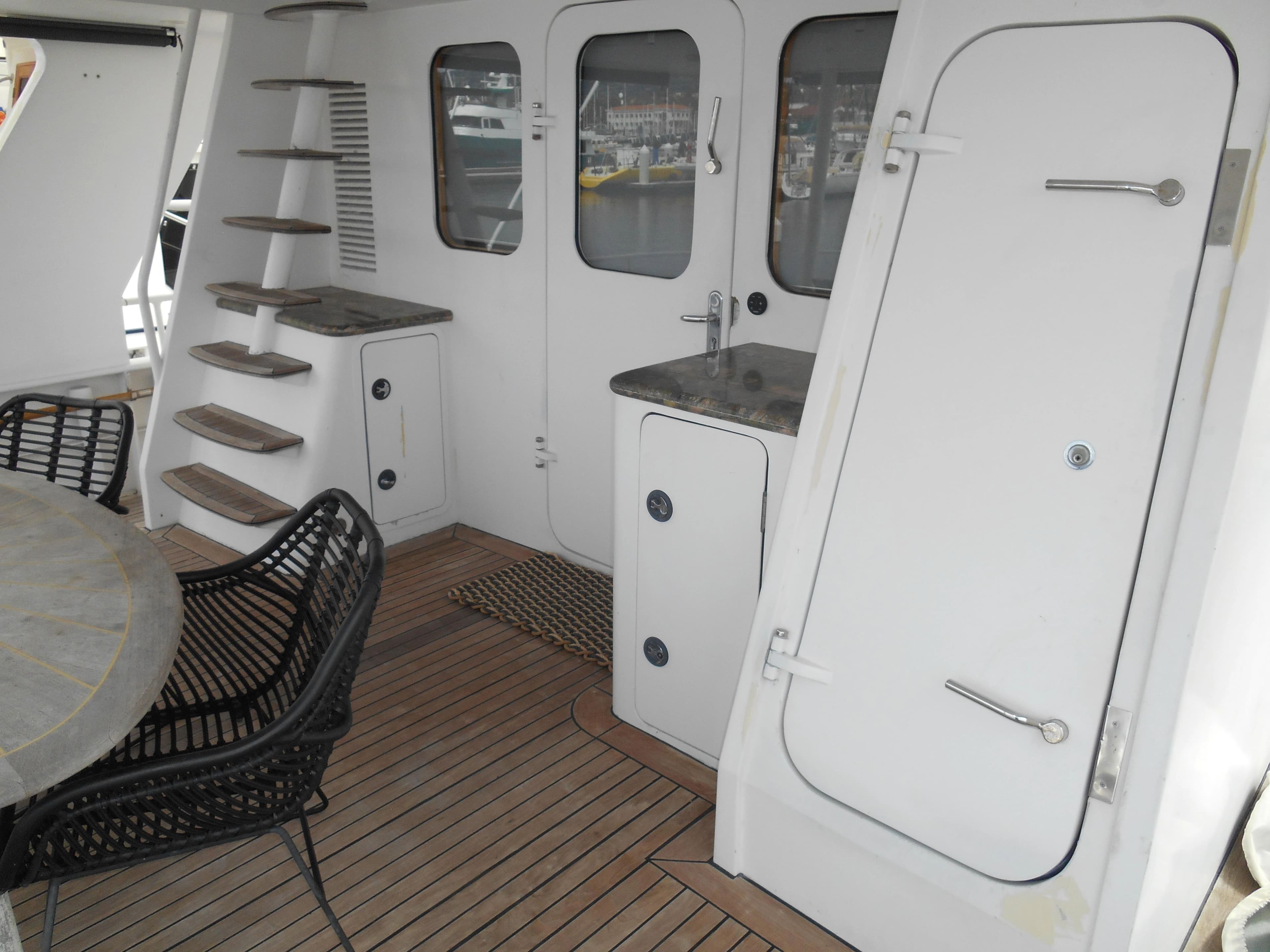 Inace 2005 yacht interior with wooden floor and stairs.