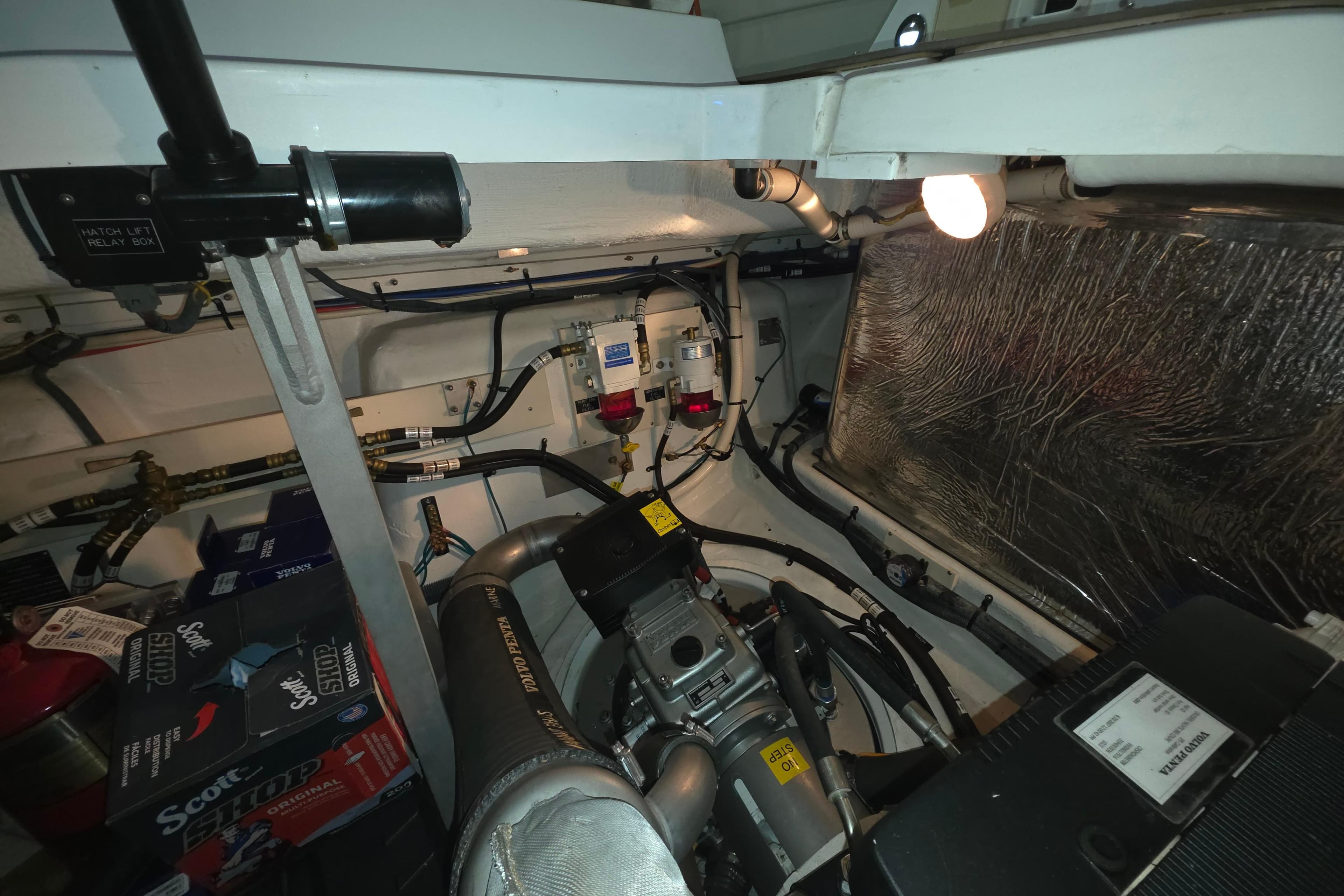 Engine room of 2008 Cruisers Yachts 390 Sports Coupe, showcasing mechanical components and wiring.