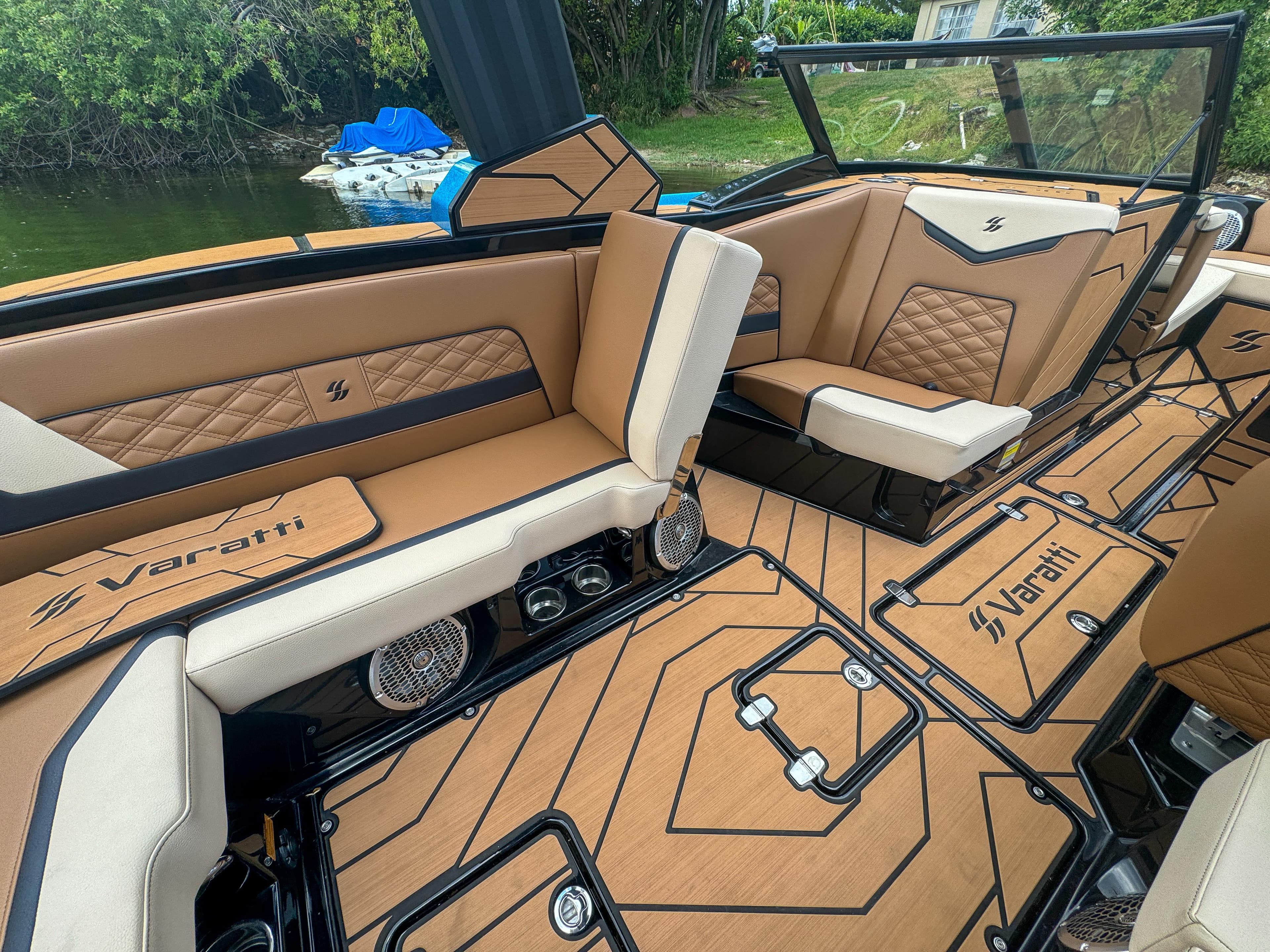 2024 Varatti Z2373 boat interior with tan and black seating, stylish design, and premium finishes.