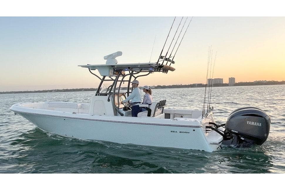 Manufacturer Provided Image: 2025 Sea Born LX26 Center Console boat cruising on water at sunset.