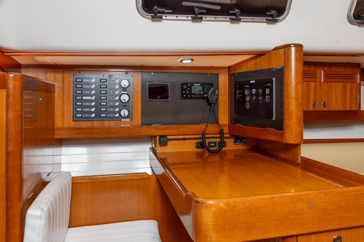 2008 J Boats J/122 interior with navigation station and control panels.