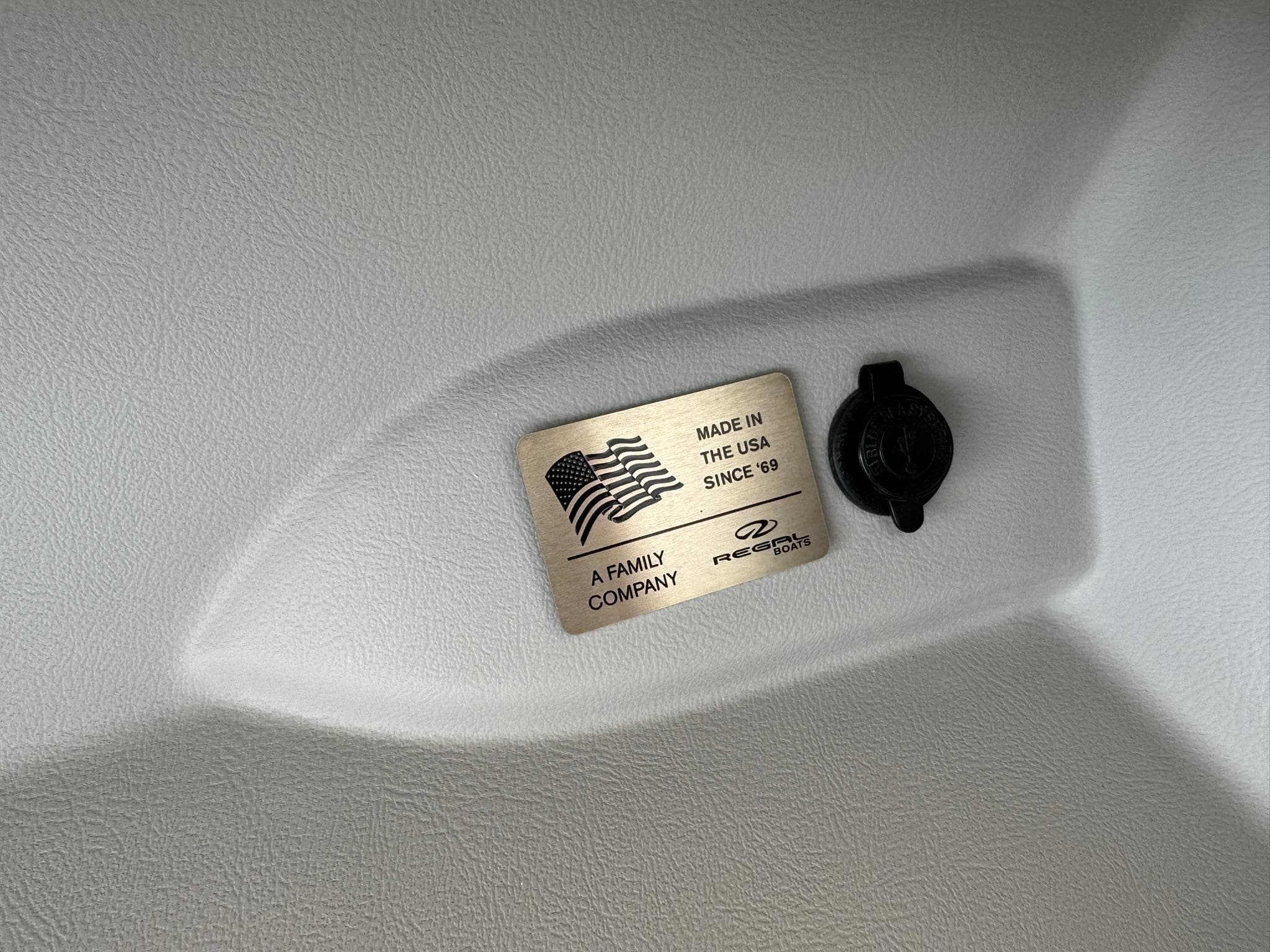 2025 Regal LS4 Surf boat interior with "Made in the USA" plaque and company logo.