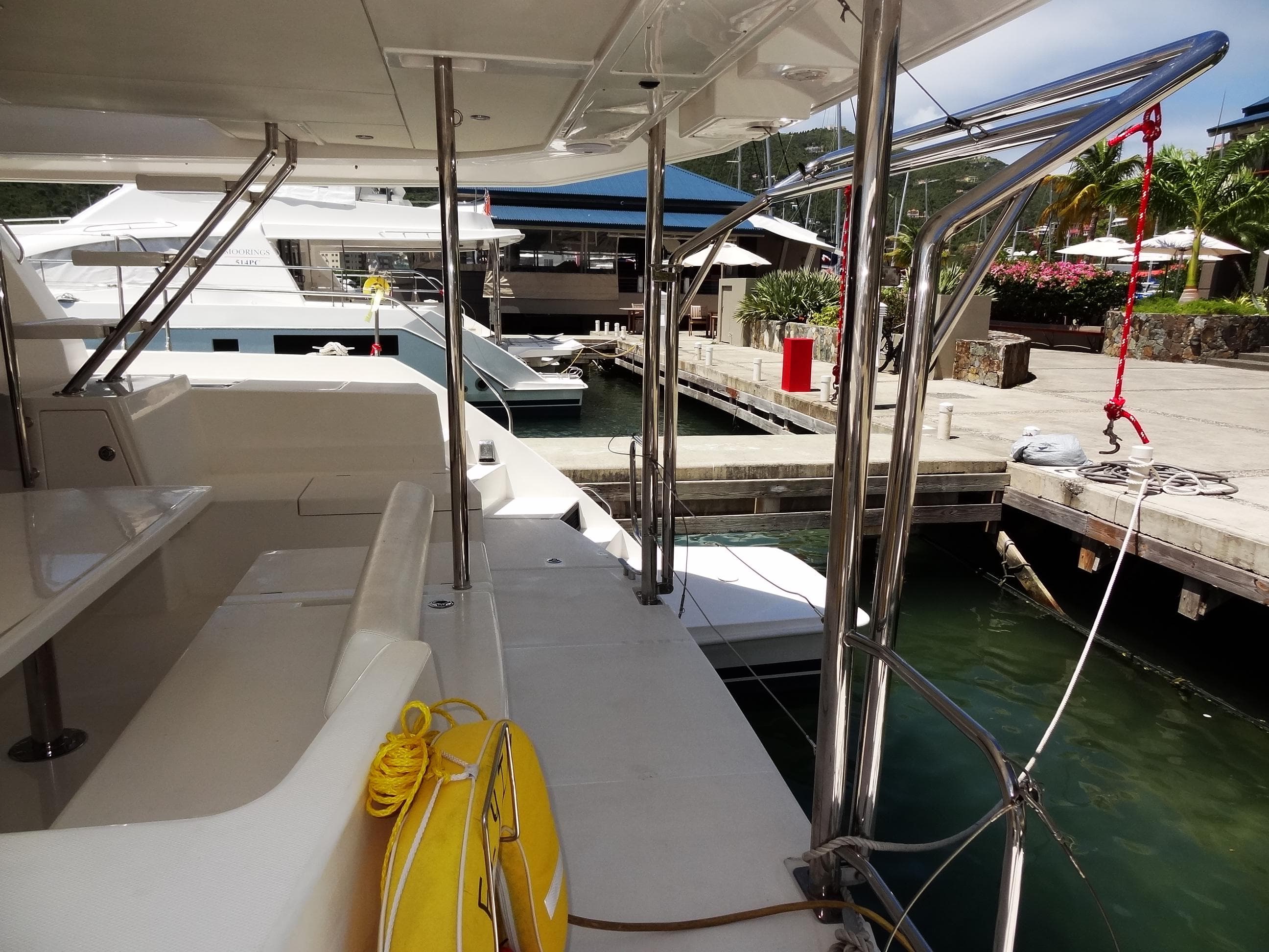 2017 Leopard 43 Powercat docked at marina, featuring spacious deck and modern design.