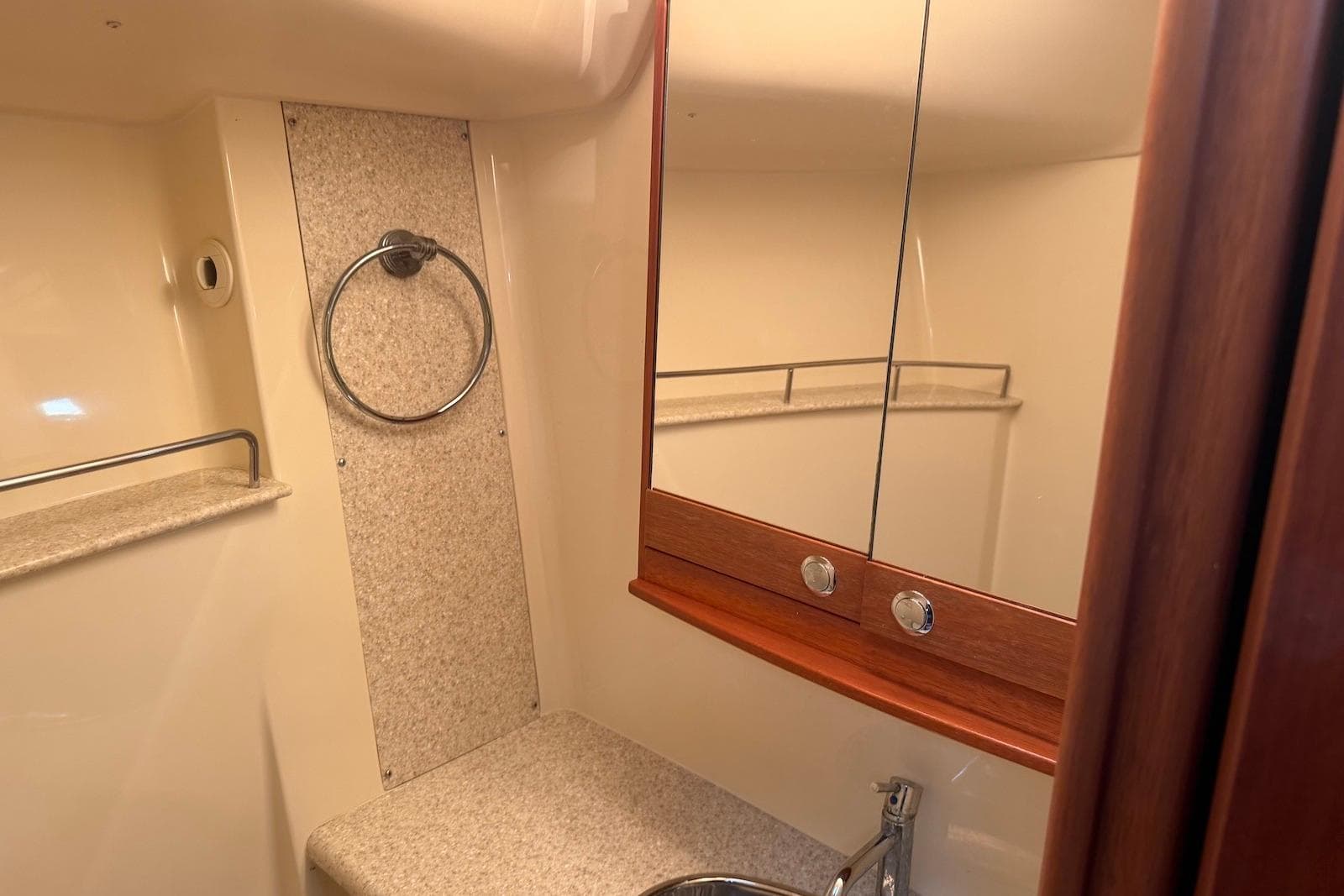 2009 Hunter 50 Center Cockpit bathroom with mirror, sink, and towel ring.