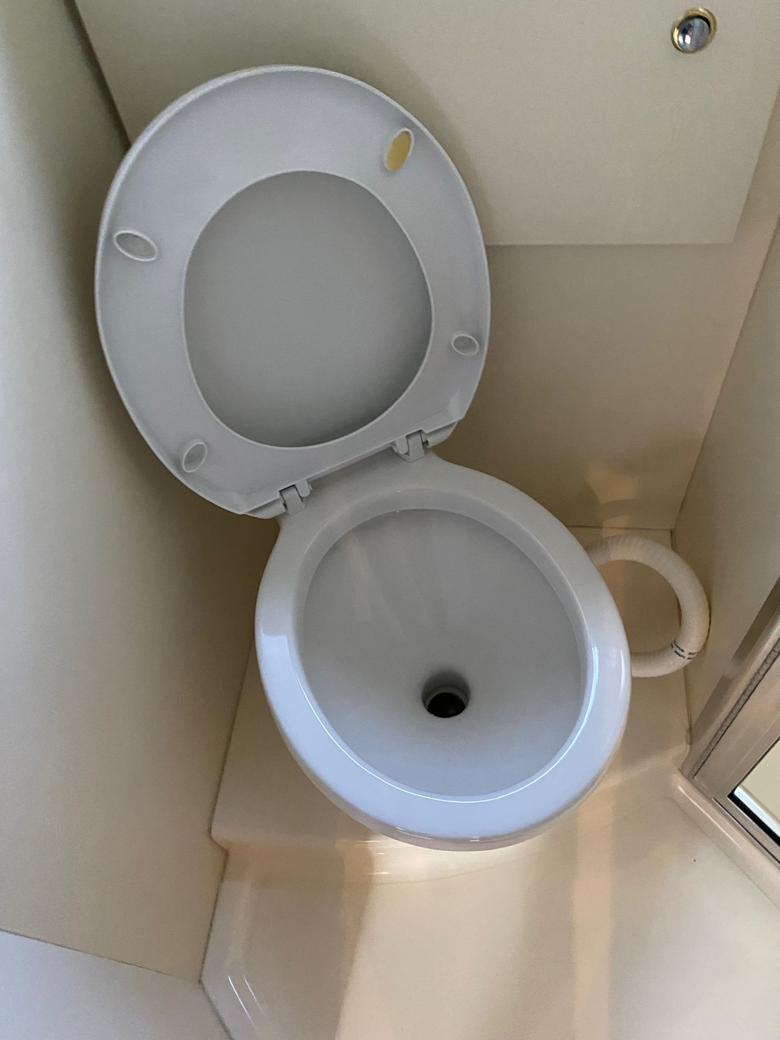 Toilet in a 2002 Silverton 330 yacht bathroom.