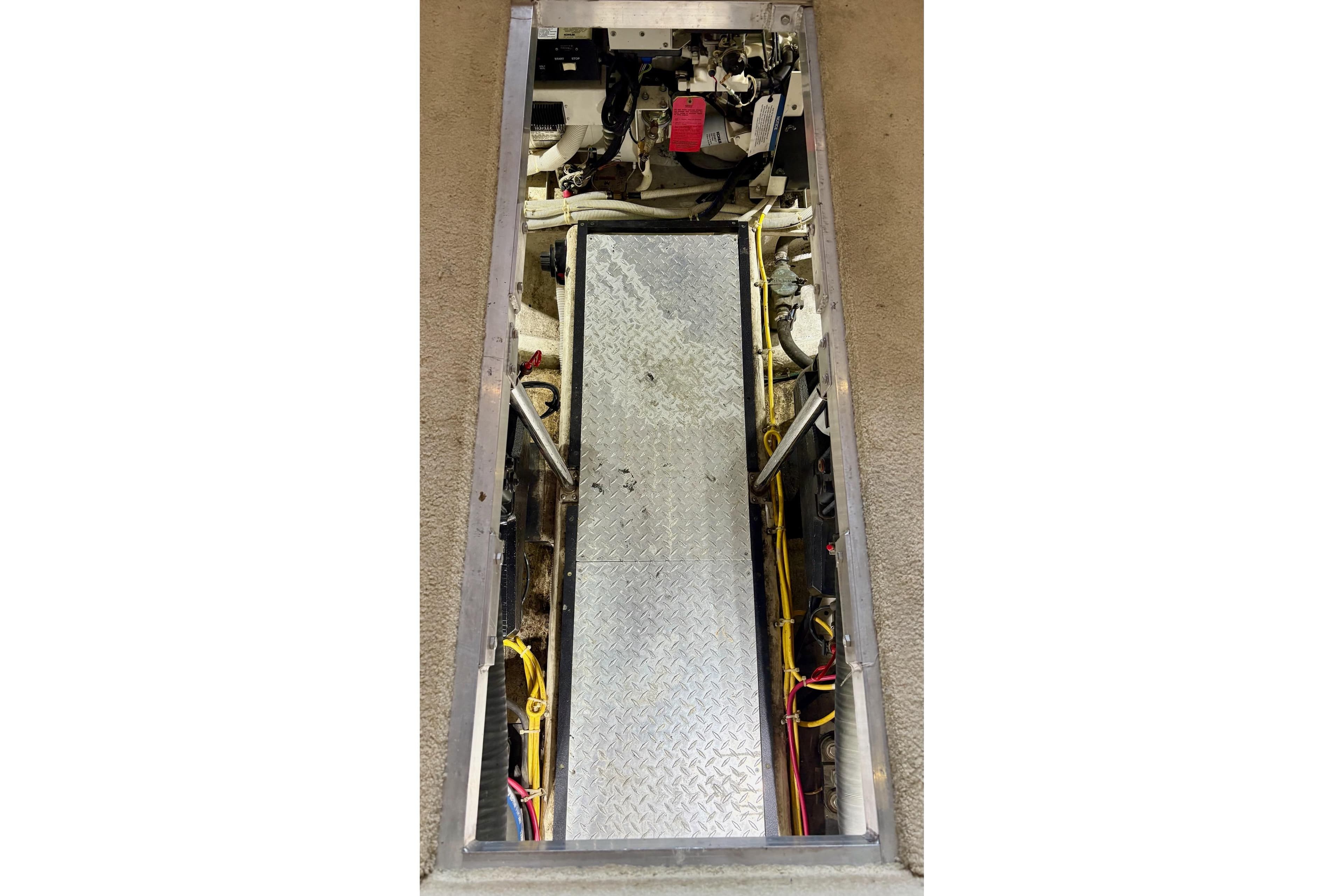 Engine compartment of a 2003 Carver 396 Motor Yacht, featuring mechanical components and wiring.