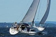 1983 C&C 29 MkII sailboat navigating open waters with full sails.