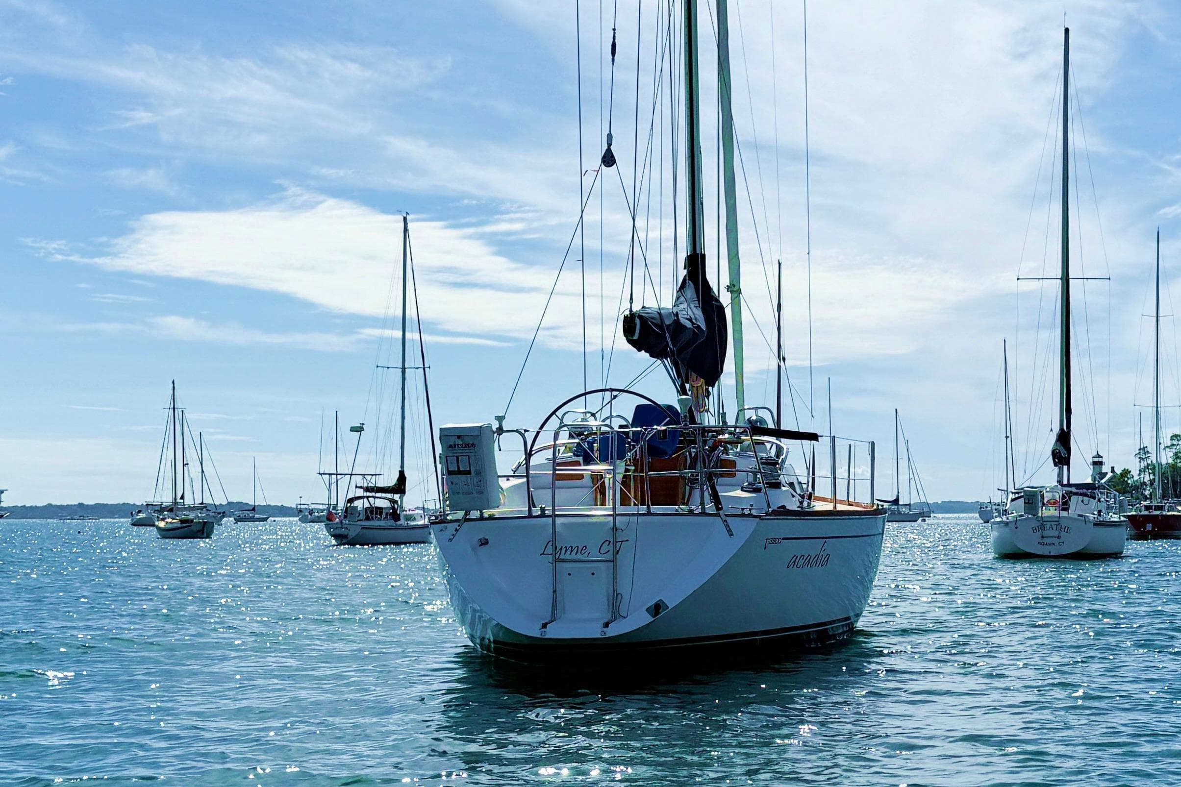Sailboats anchored on a sunny day, featuring a 1997 Tartan 3800 model.