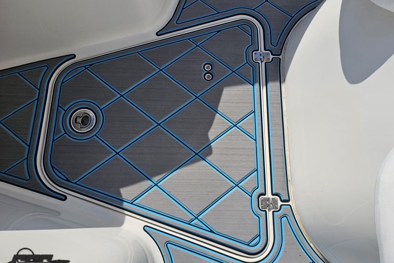 Deck detail of 2013 Sea Fox 286 Commander boat with blue and gray pattern.