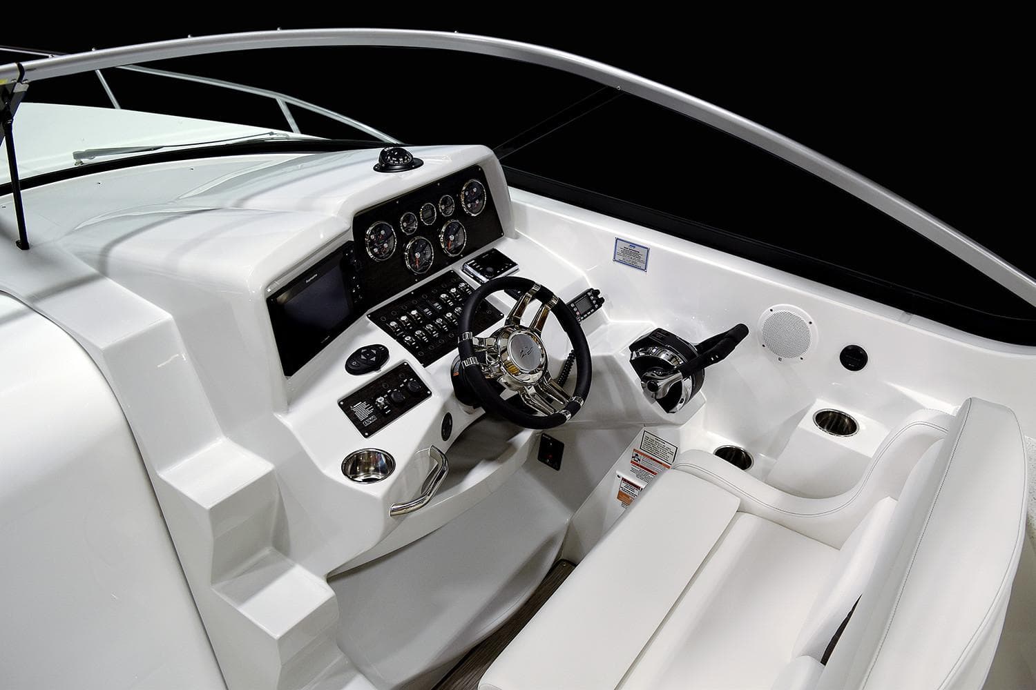 Manufacturer Provided Image: 2018 Rinker EX 320 boat helm with modern controls and white seating.