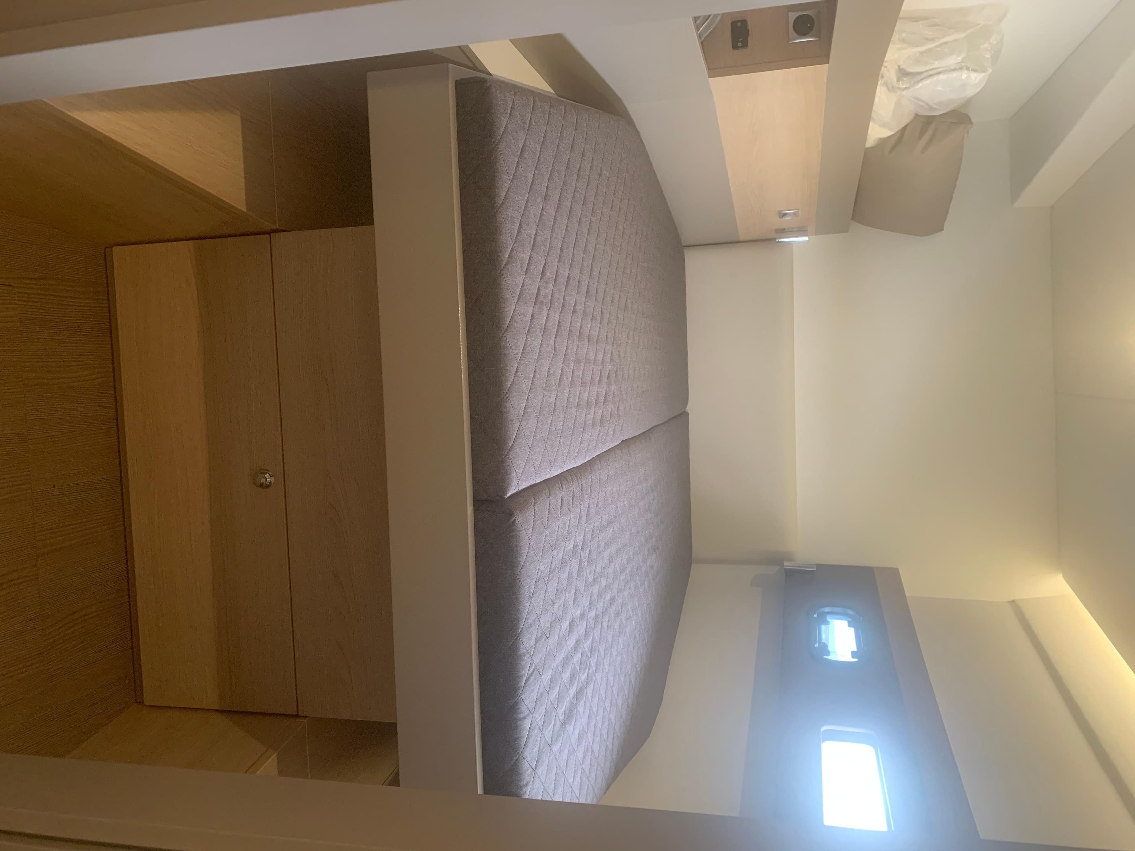 Cozy cabin interior of a 2020 Bali 4.5 yacht with a comfortable bed.