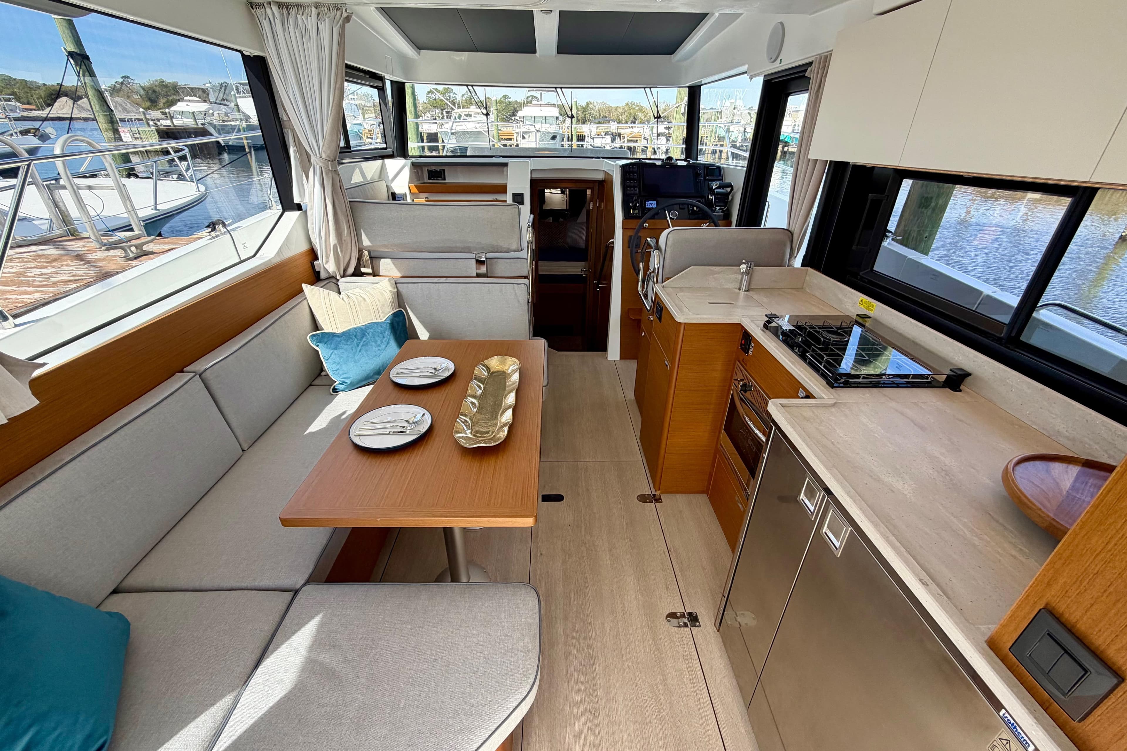 Interior of 2026 Beneteau Swift Trawler 37 Fly, featuring modern kitchen and dining area.