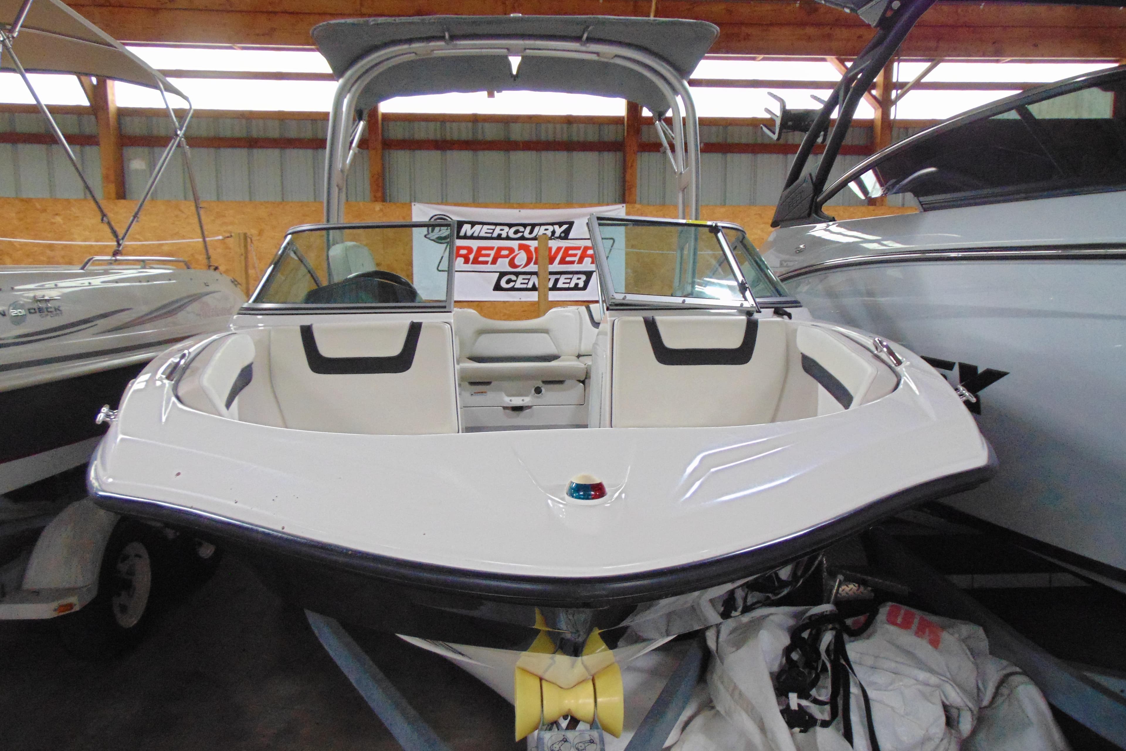 2016 Yamaha Boats AR190 in storage, featuring sleek design and spacious seating.