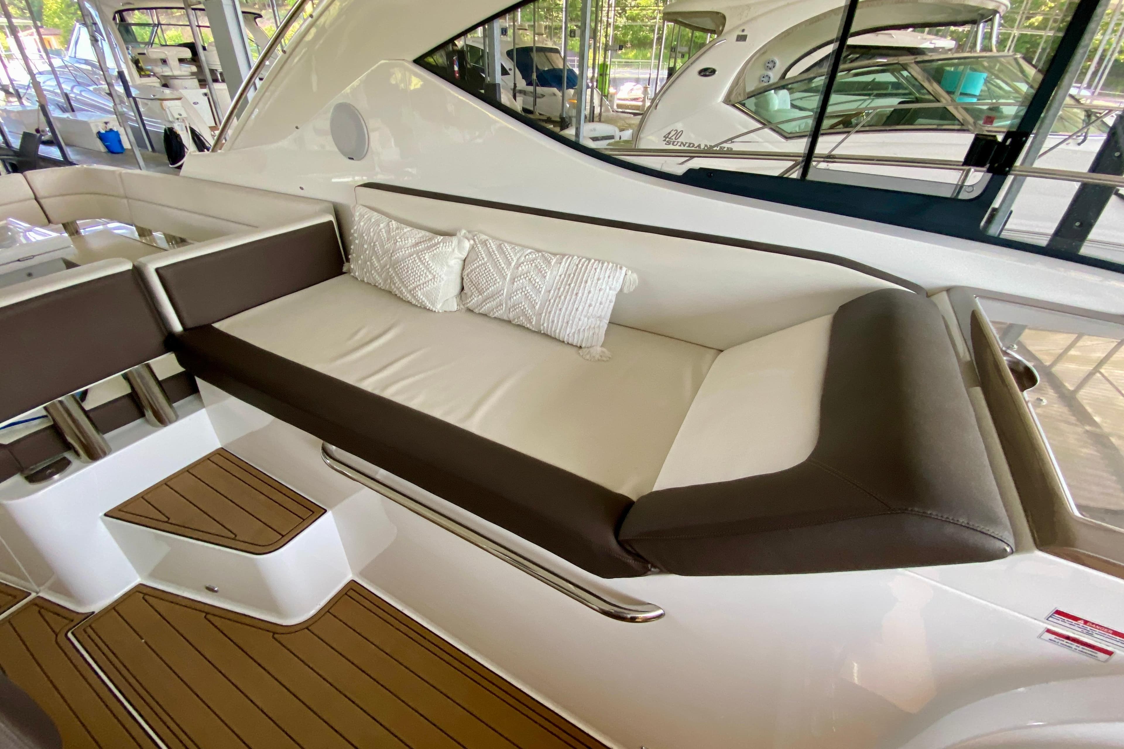 Luxurious seating area on a 2018 Galeon 385 HTS yacht with elegant cushions.